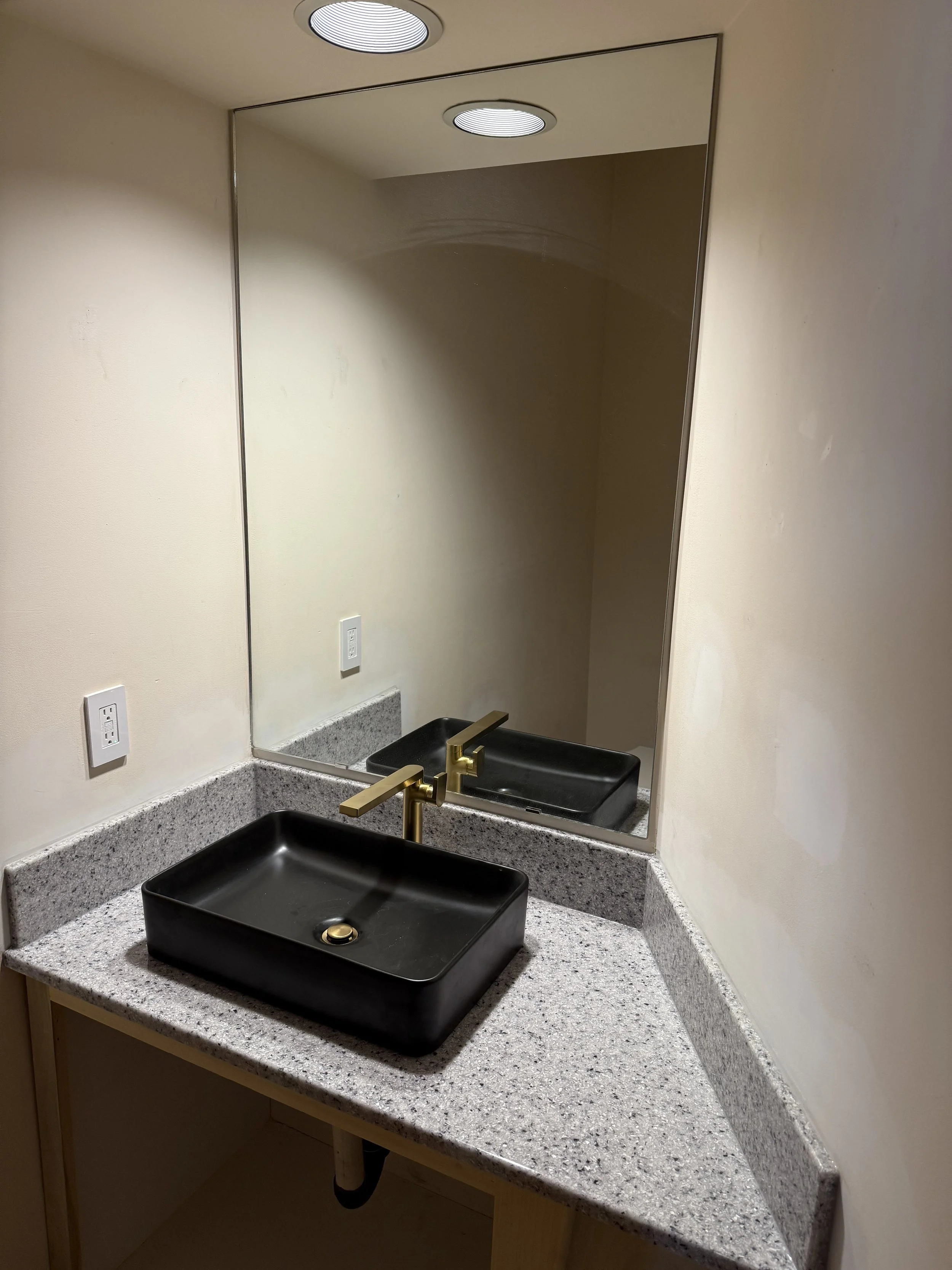 Onyx Collection countertop with vessel sink and Kohler faucet