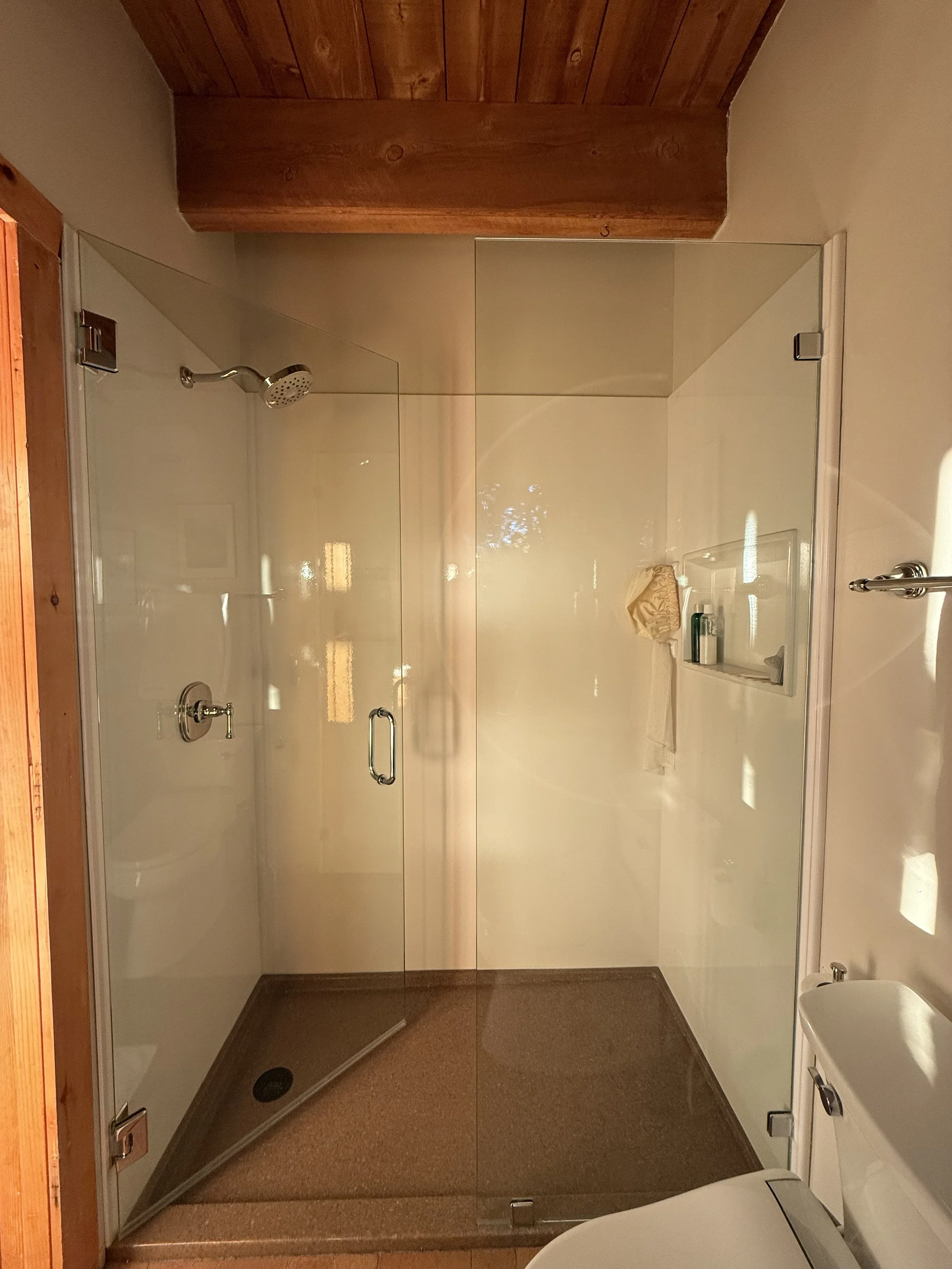 Tub replaced with Onyx Collection custom shower with extra wide caddy. 