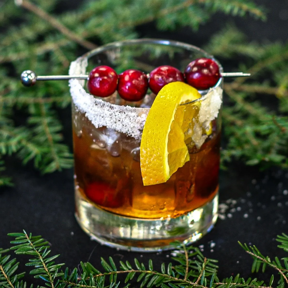 A holiday twist on a timeless classic 🥃🧊🍒
Meet our Cold Fashioned✨

&bull; 2 oz Bulleit Rye
&bull; 1 oz Cranberry Simple Syrup
&bull; 2 dashes Angostura Bitters
&bull; Orange slice garnish
&bull; Sugared rim
&bull; 3&ndash;5 fresh cranberries

Hap