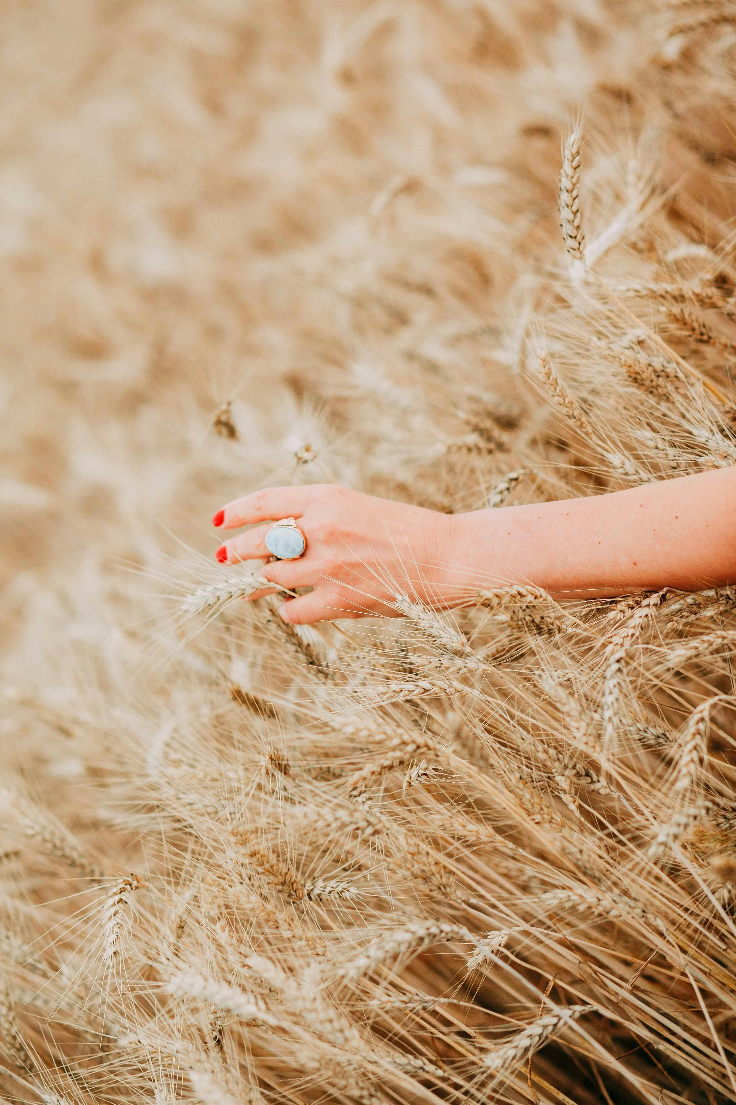 woman with the hand on the grass