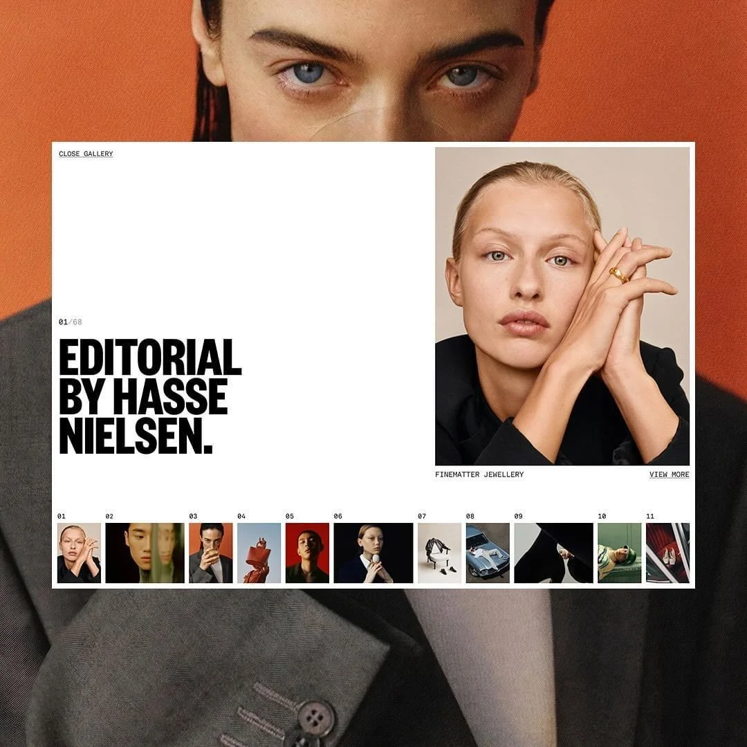A fashion magazine spread over a person's chest and shoulders with a large close-up of a person's eyes at the top, and a smaller portrait of a woman with blonde hair and blue eyes resting her chin on her hand. The page includes text that says 'Editor