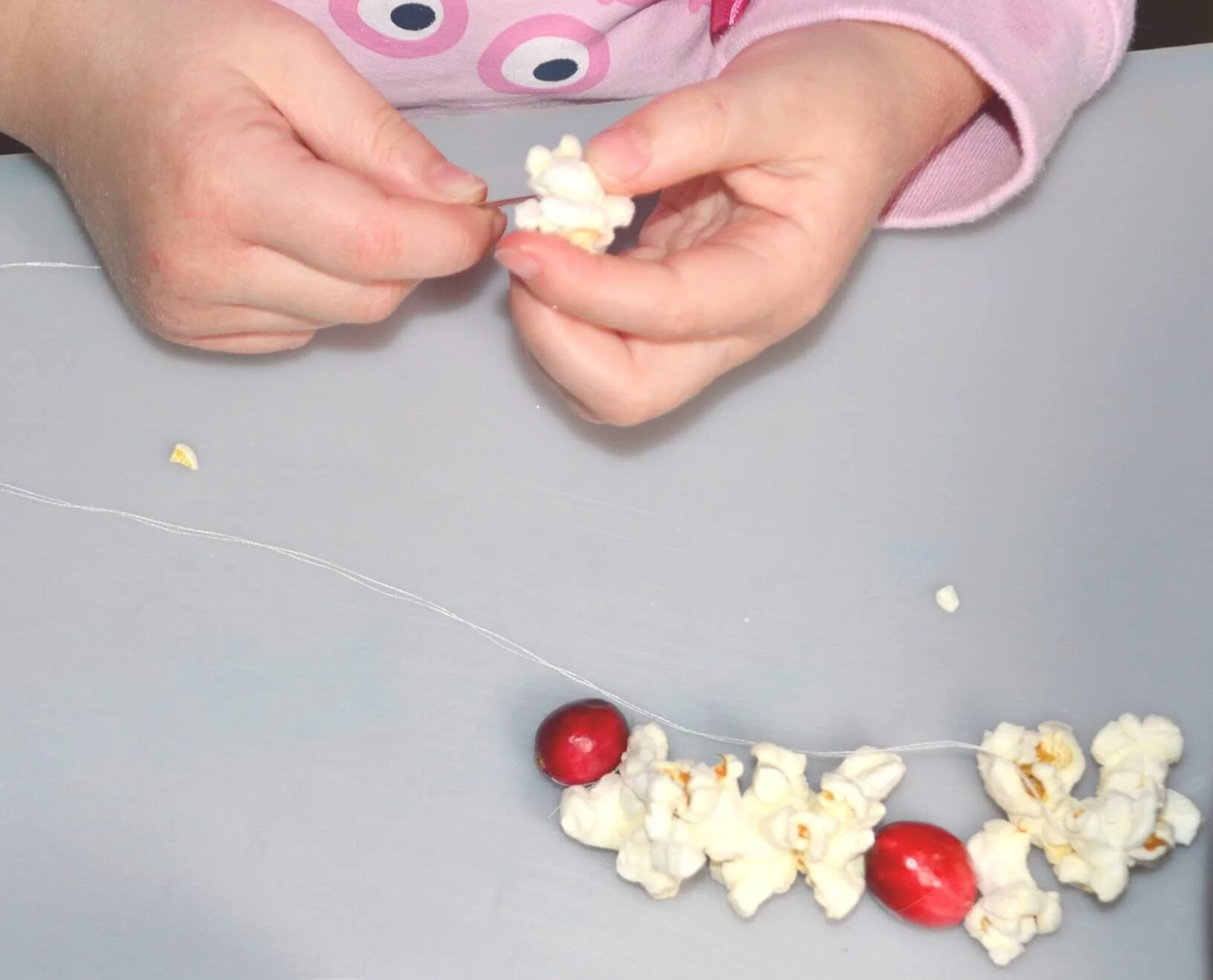 How to Make a Popcorn Garland with Kids — Learning Here and There