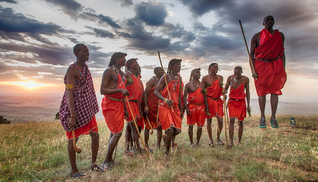 Massai-warriors-jumping-on-a-Tanzania-Safari-with-andBeyond-with-sunset.jpg