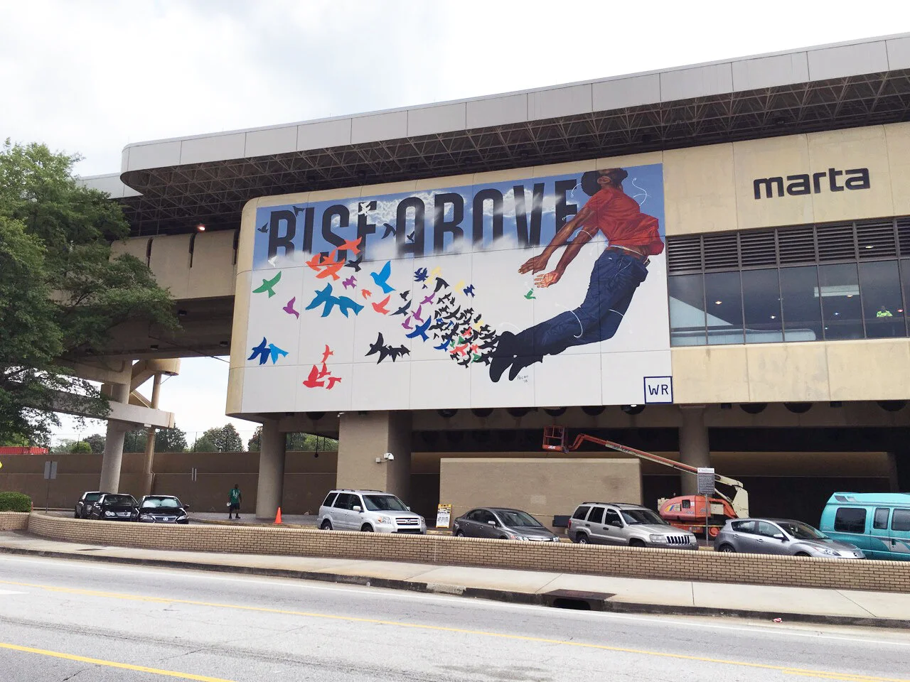 Working with MARTA, WonderRoot commissioned Fahamu Pecou to produce permanent murals at MARTA stations throughout the City. Featured here is Pecou's "Rise Above" image on the King-Memorial Marta Station.