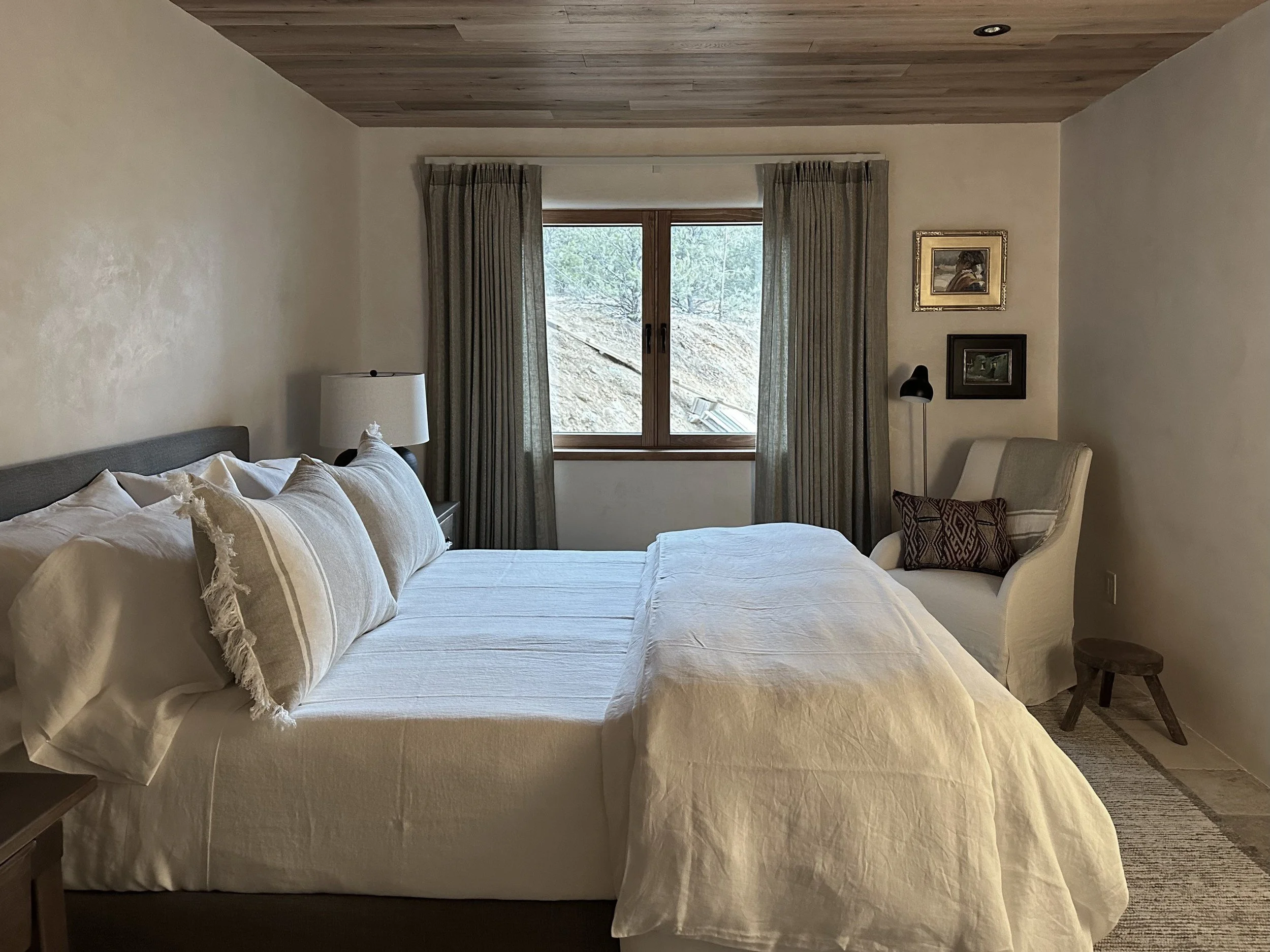 new-mexico-hideaway-15-guest-bedroom-hillside-window.jpg