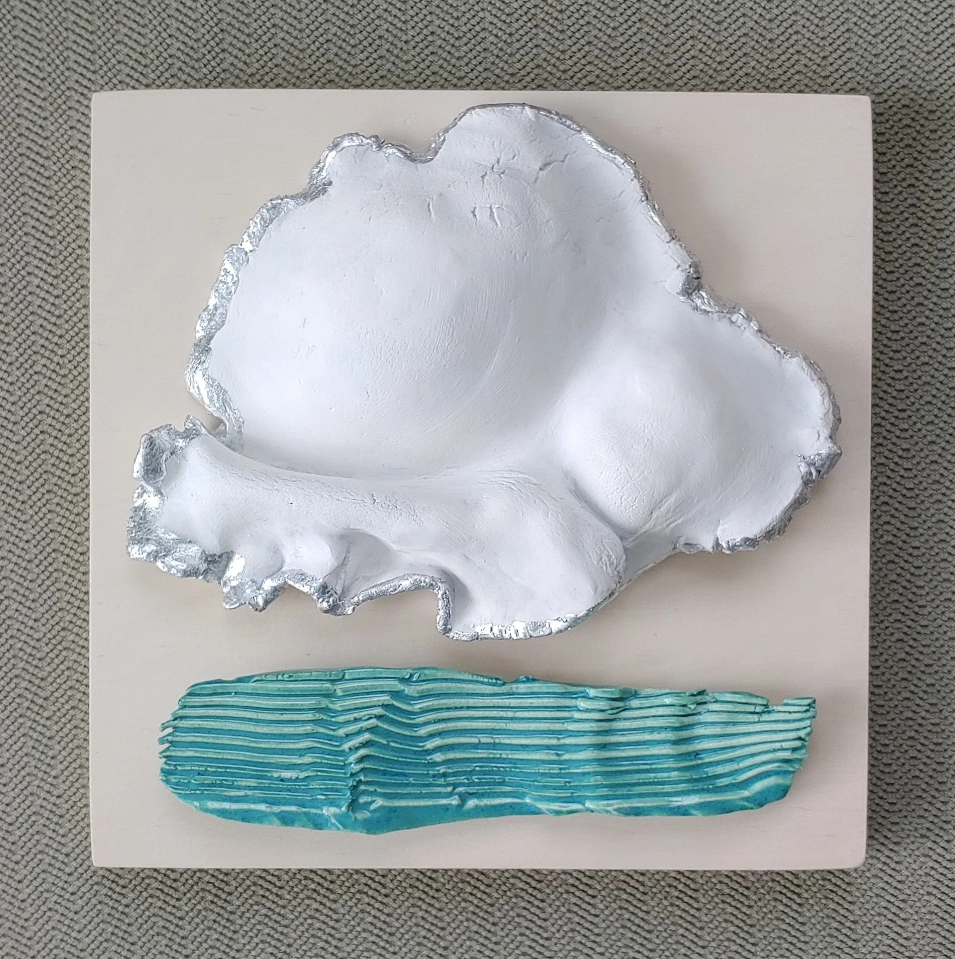 Look for the Silver Lining; Clay on Wood with Silver Leaf; 8"x8"; $98; nnuluv1@aol.com
 