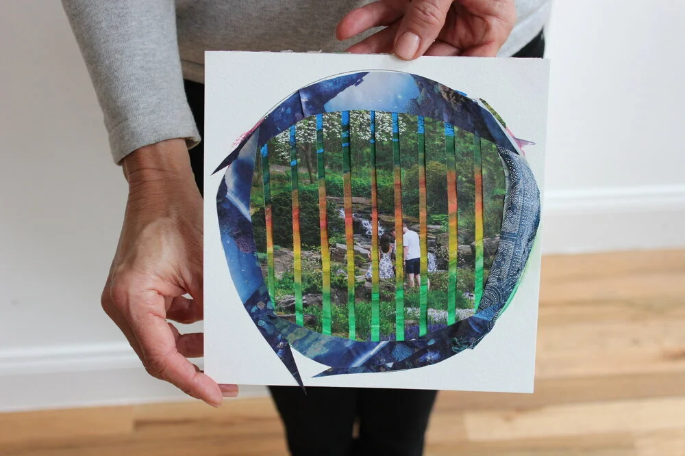 Corporate Wellness Art Therapy prompt of Person holding a square piece of paper with a collage of a natural landscape and a circular cutout showing a forest scene with two children. Created in a NYC workplace well-being workshop.