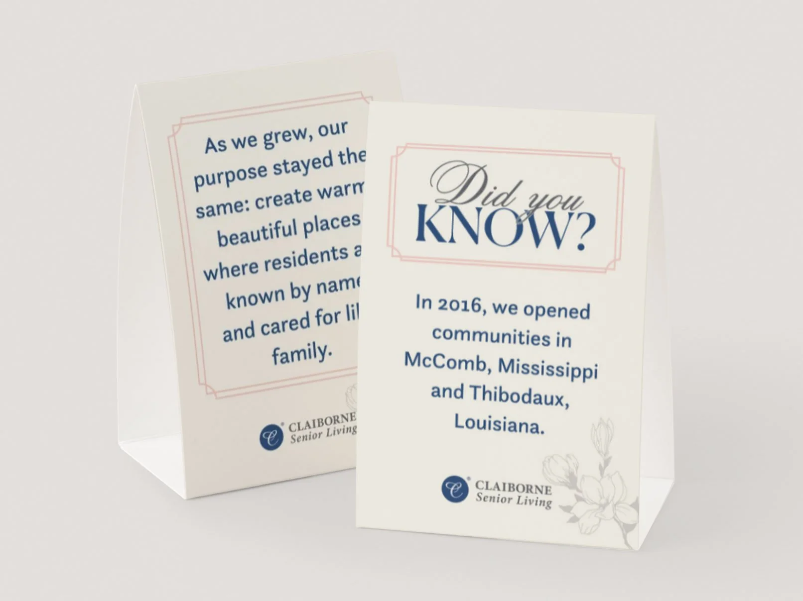 Two informational pamphlets from Claiborne Senior Living with text about their community opening in 2016 in McComb, Mississippi, and Thibodaux, Louisiana, featuring decorative floral designs and the Claiborne logo.