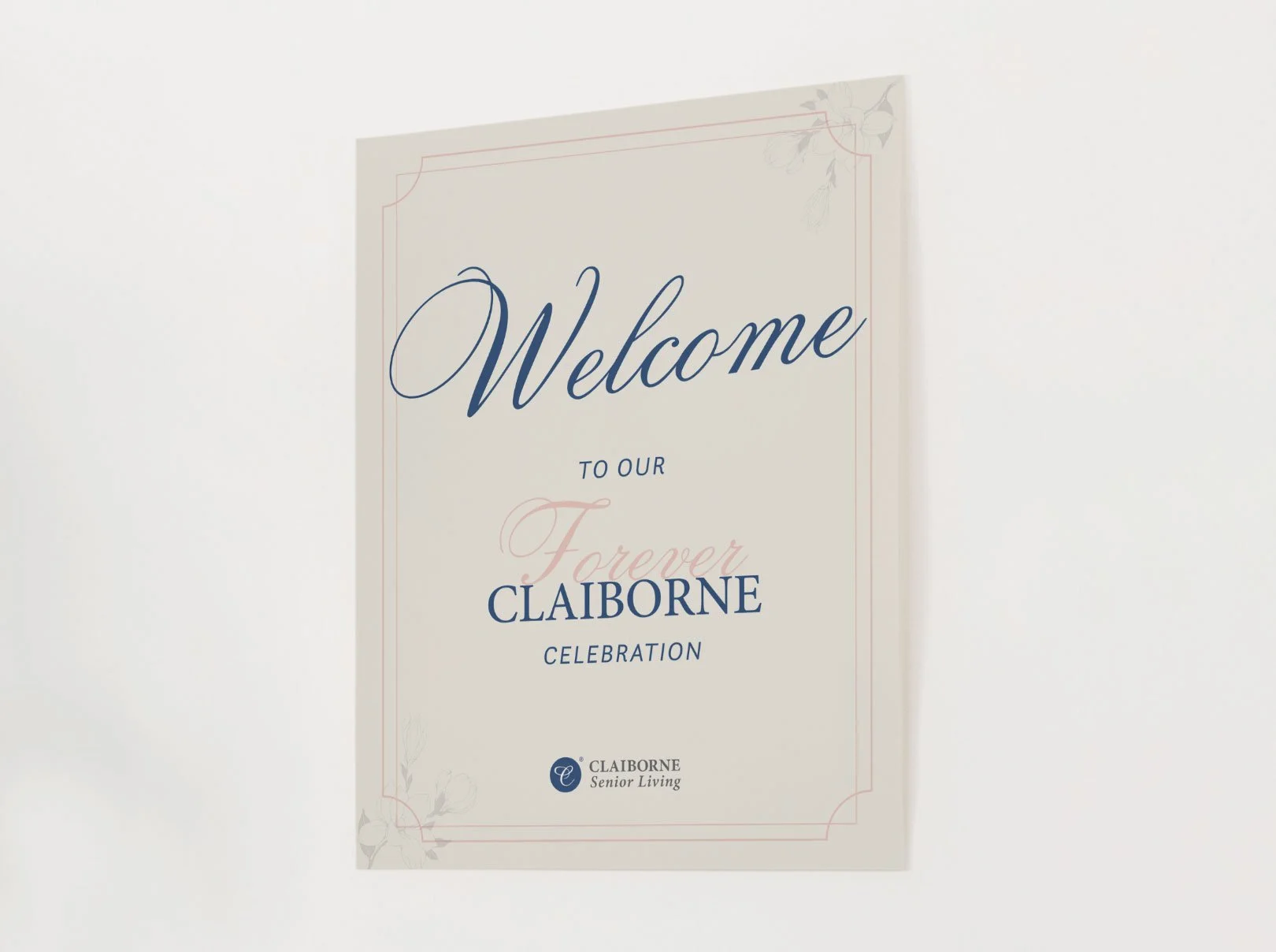 Welcome sign with floral accents and the text 'Welcome to our Forever CLAIBORNE Celebration' from Claiborne Senior Living.