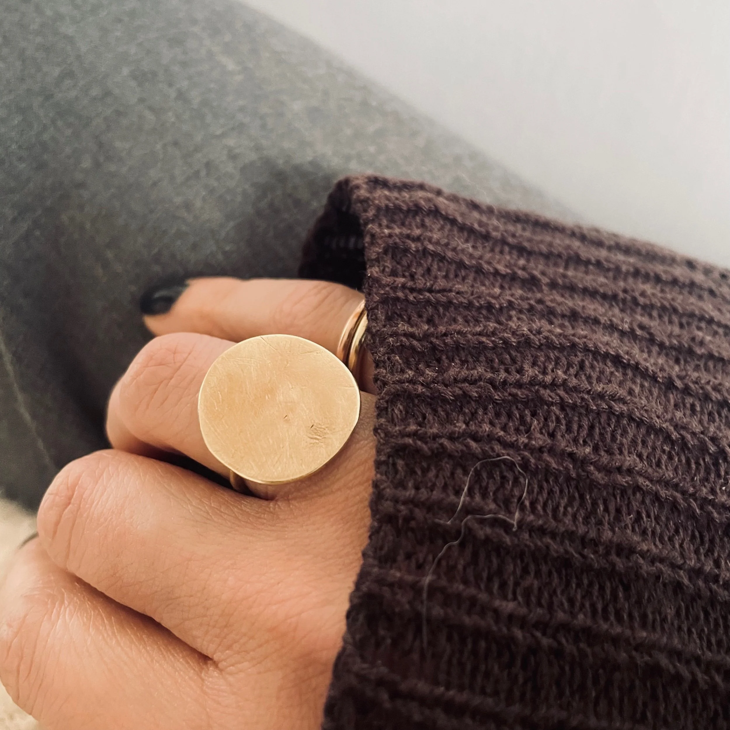 Handmade solid recycled gold circle ring shown worn