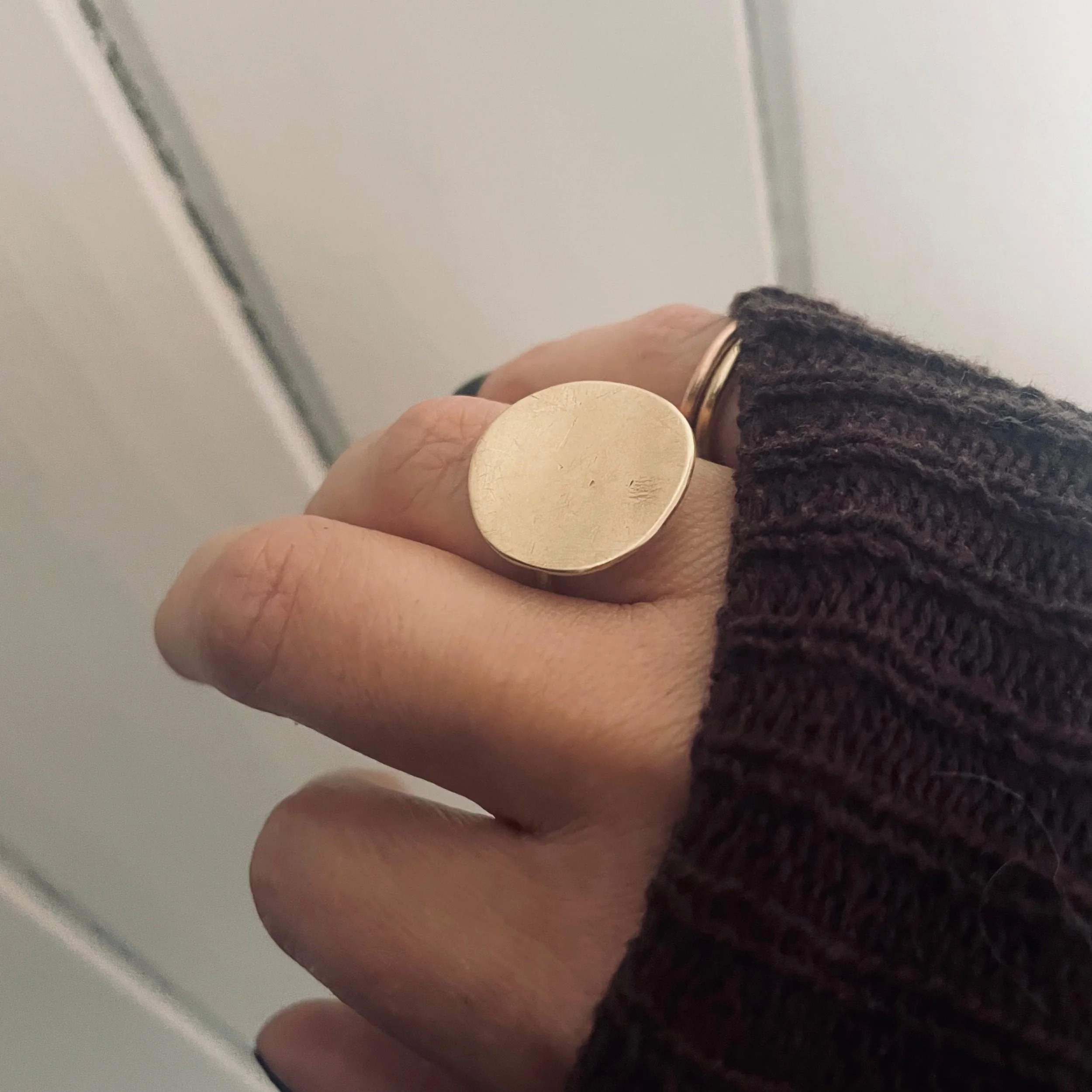 Handmade solid recycled gold circle ring photographed worn