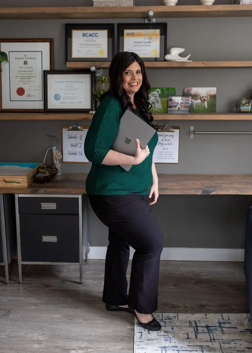 Elizabeth Nardella in her South Surrey office with her framed credentials behind her