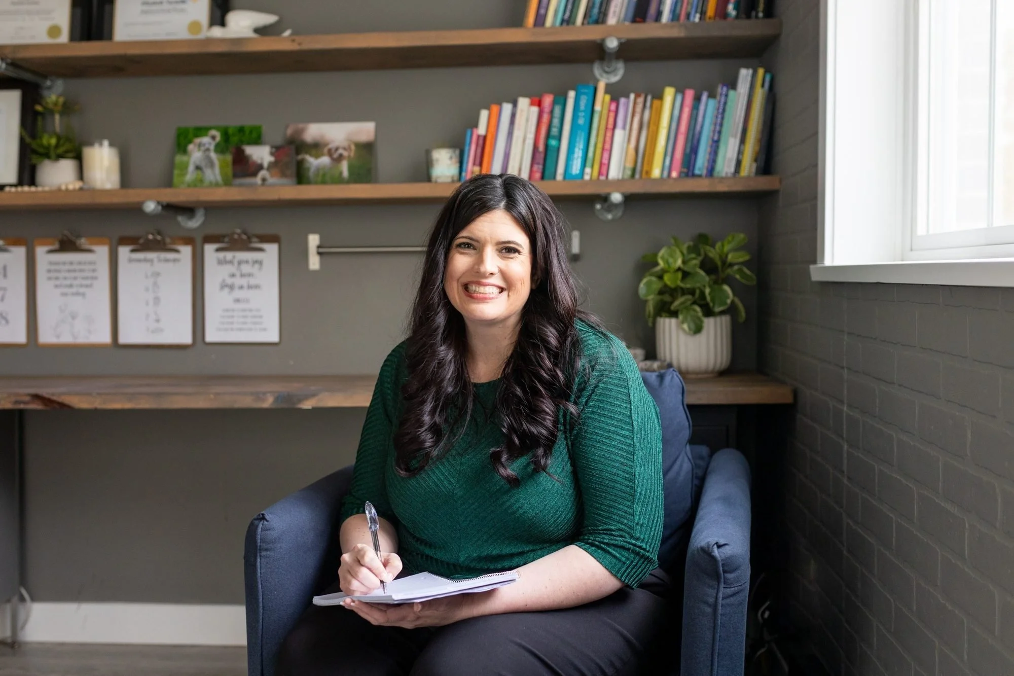 Elizabeth Nardella, RSW, RCC, smiling at her desk in her South Surrey counselling office