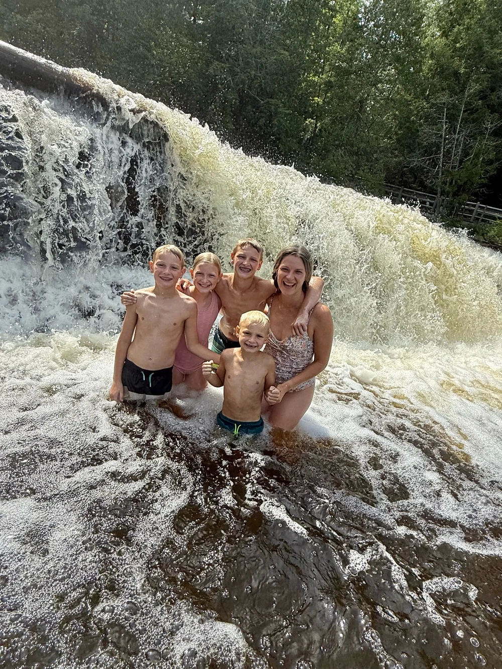 Climb underneath the Lower Falls