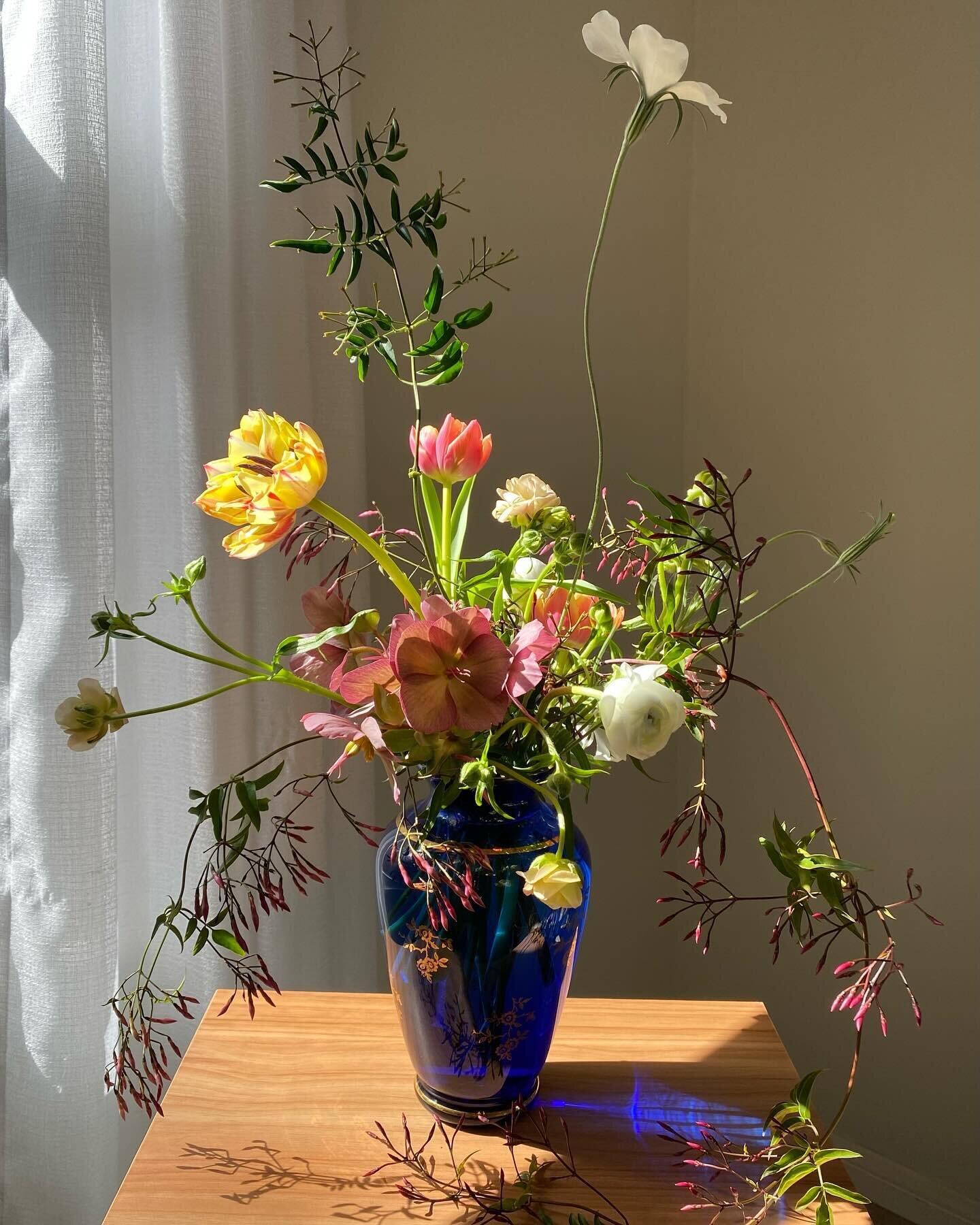 Jasmine, Hellebores, Double Tulips, Agrostemma &amp; Ranunculus in a &lsquo;Joska Waldglash&uuml;tte&rsquo; vintage vase. 

Spring cleaning is in full effect with 30% off all vases (w/ flowers!) I&rsquo;m not saying I rarely offer these kinda sales b