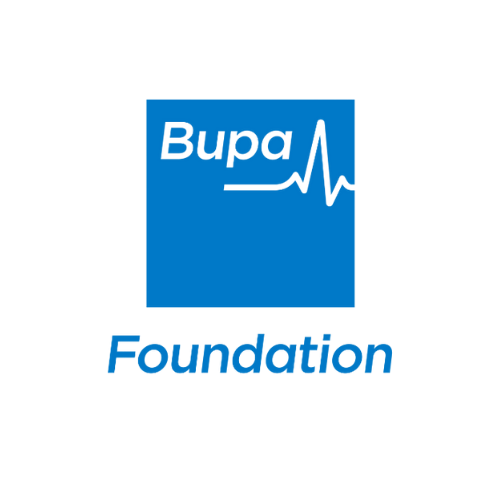 A woman in a striped shirt trimming tree branches with pruning shears while a man wearing a cap and gloves stands nearby, using long-handled pruning shears; several onlookers are visible in the background in a garden.