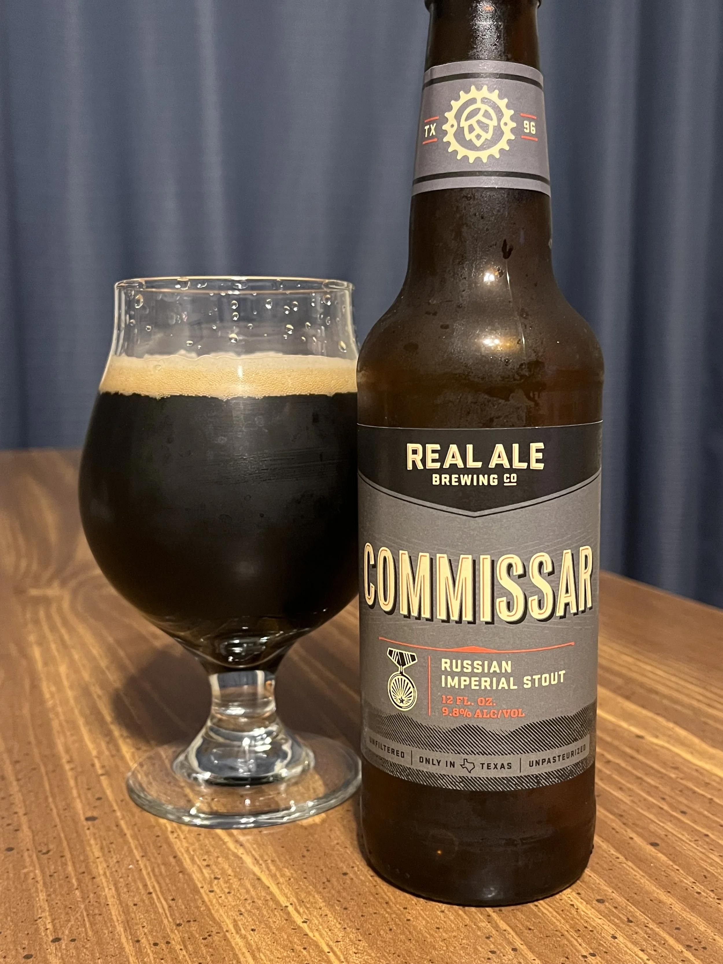 tulip glass next to Real Ale Commissar stout beer