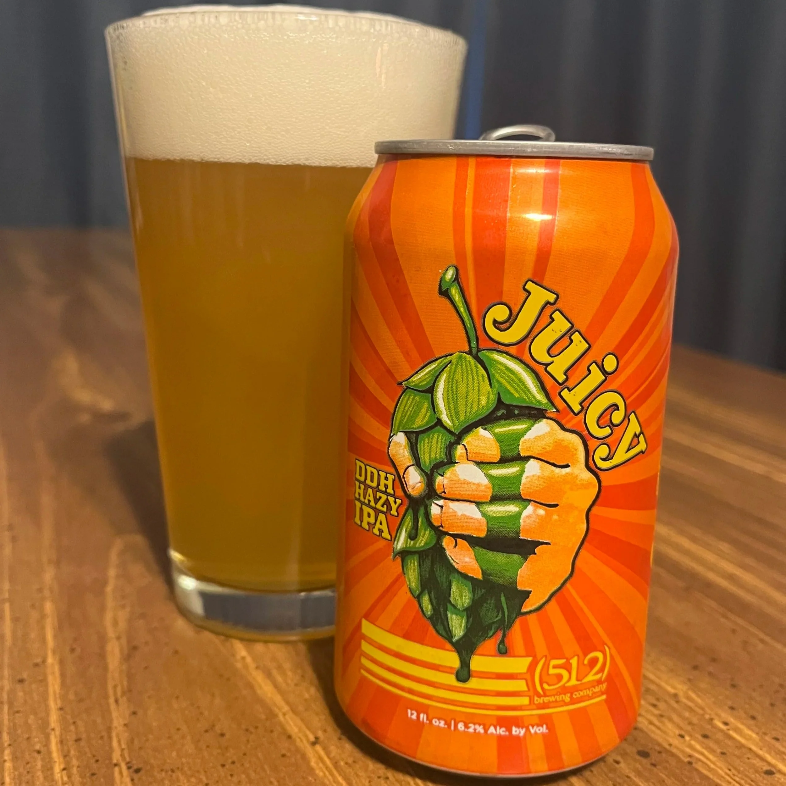 pub glass next to beer can