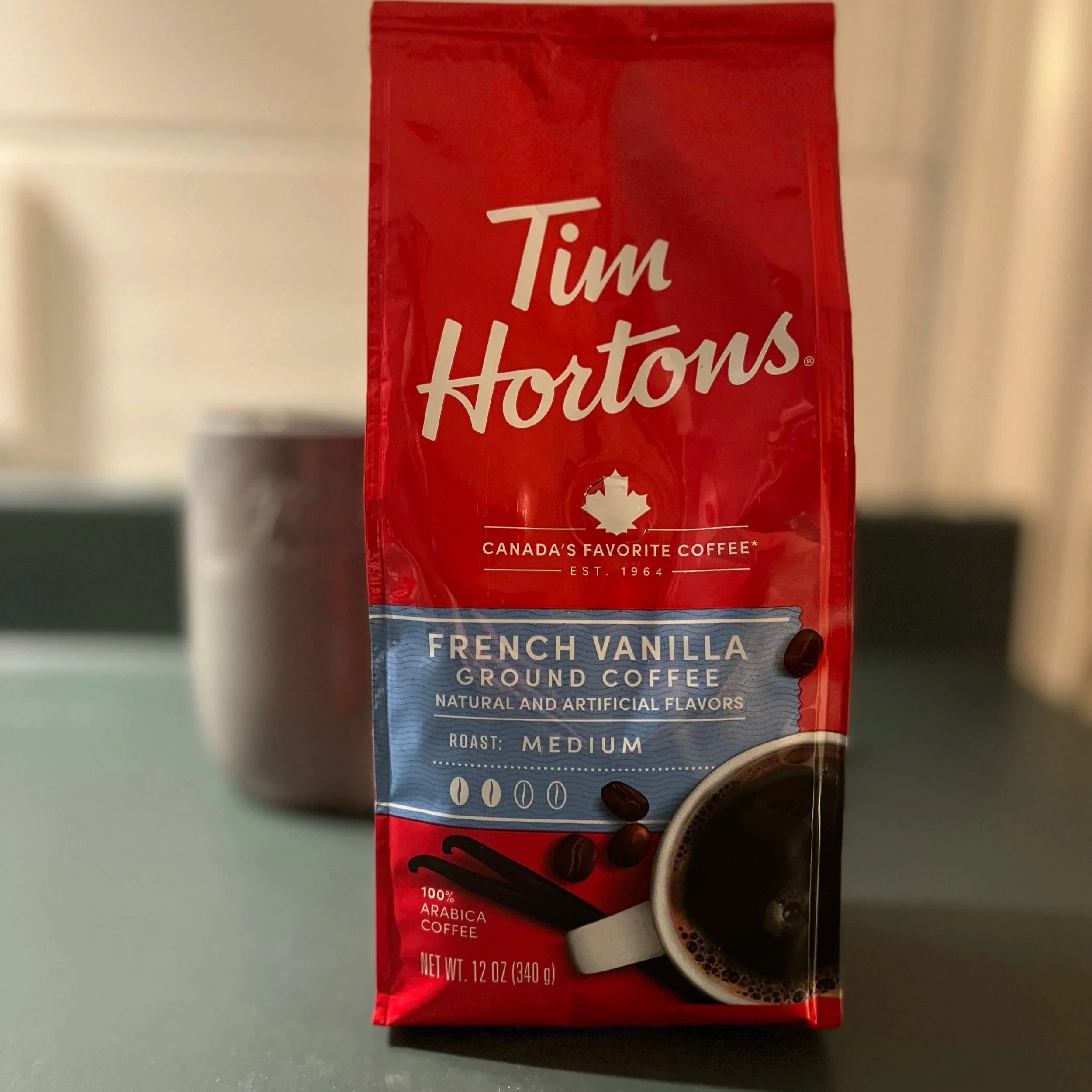 coffee mug and bag of coffee beans