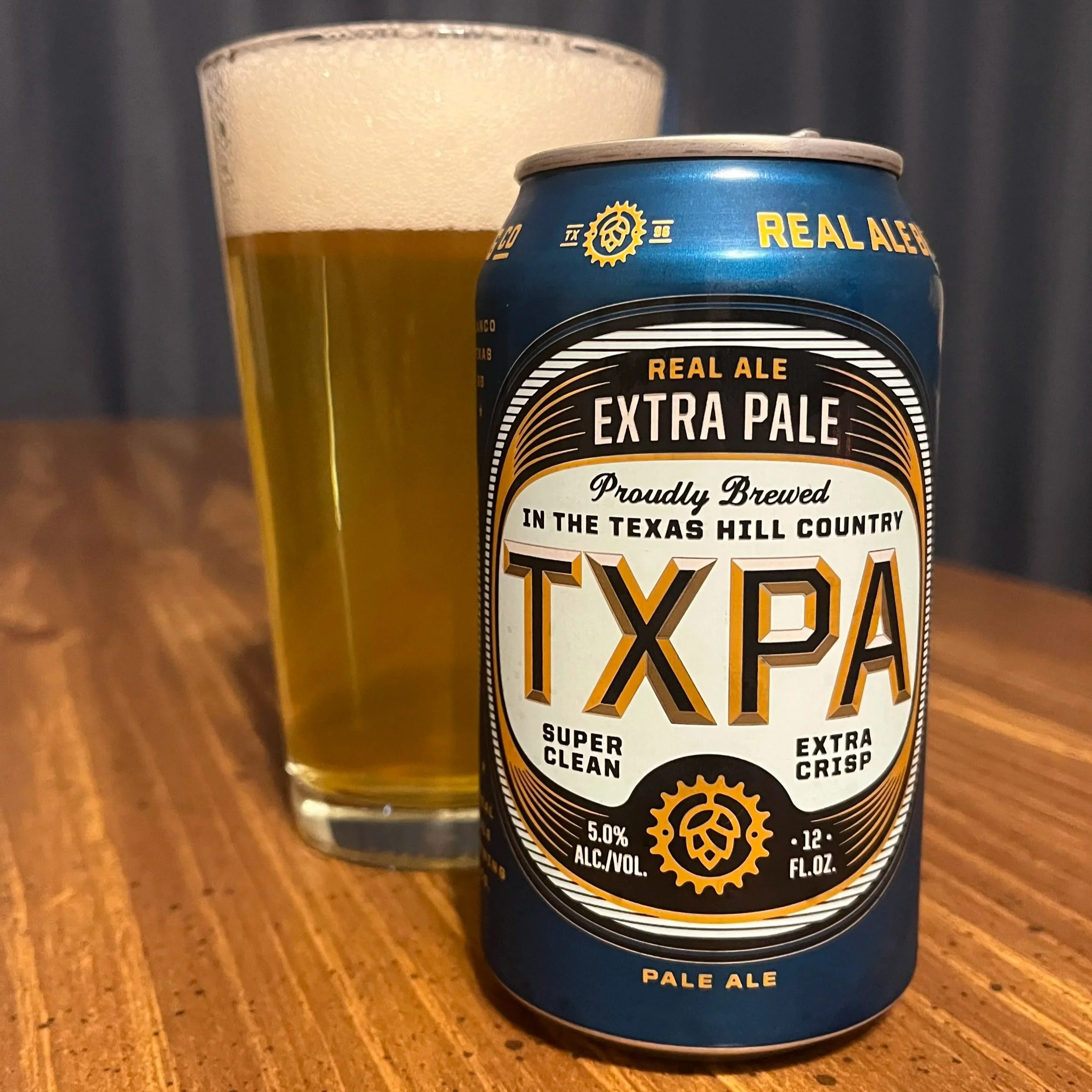 pub glass next to Real Ale beer can