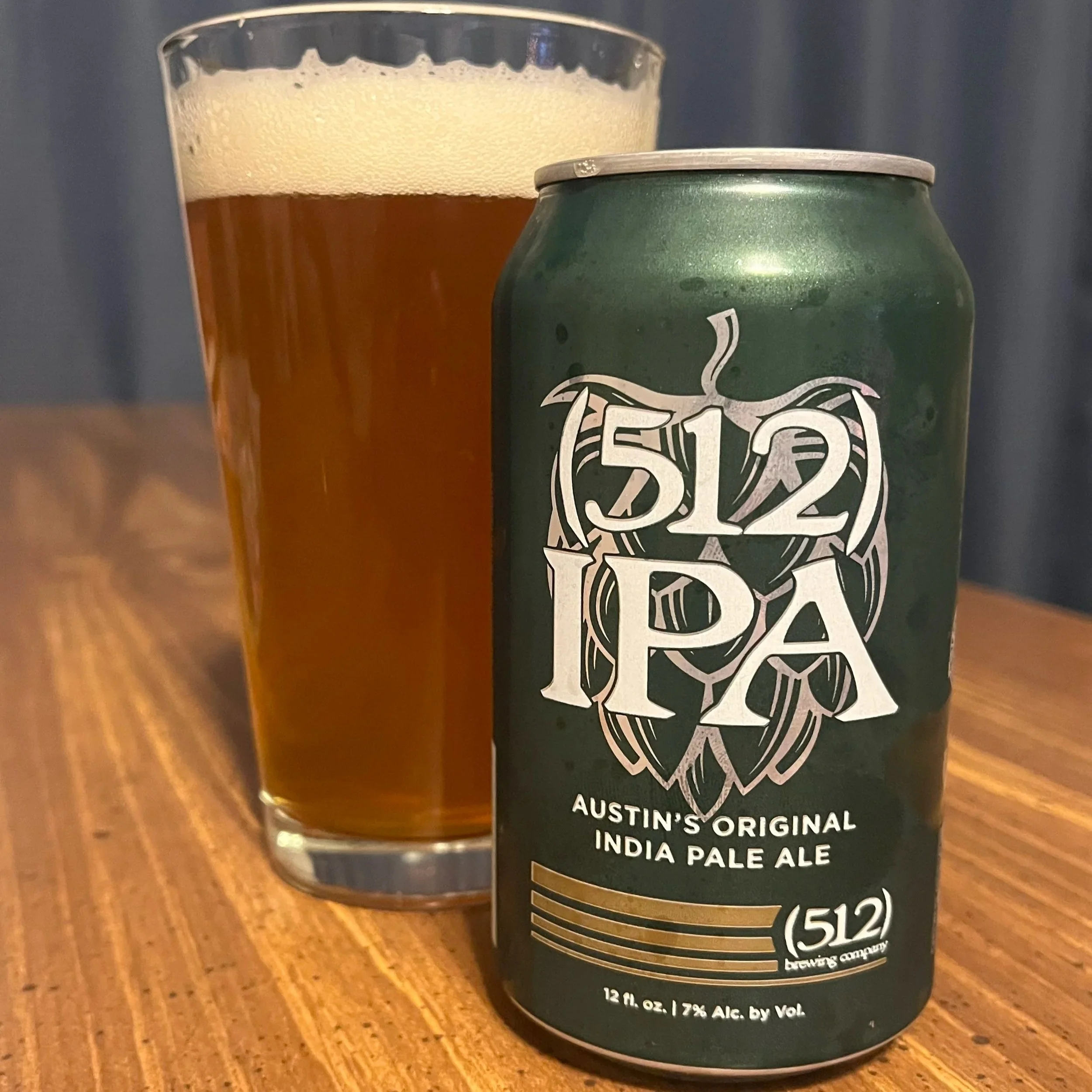 pub glass next to beer can