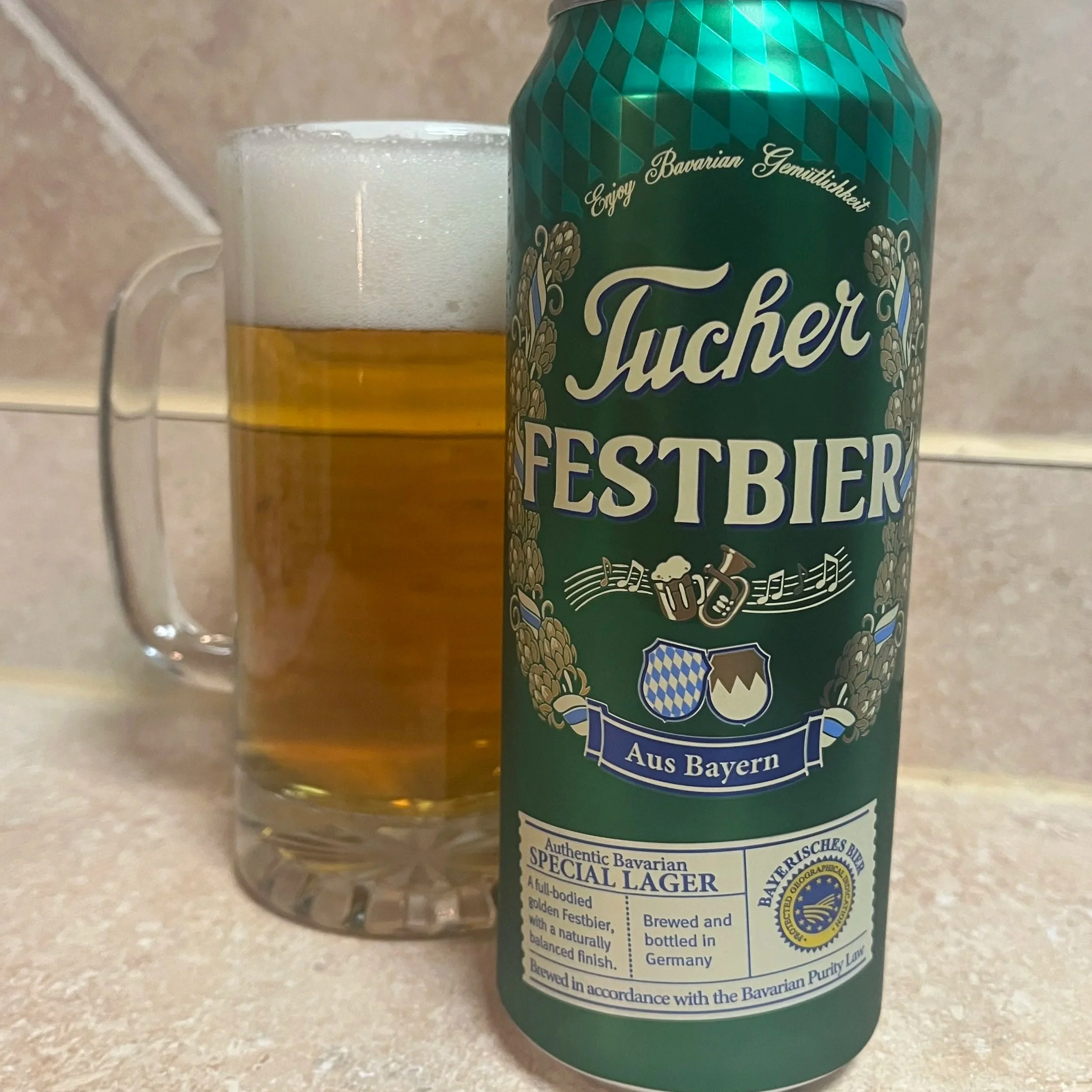 beer stein next to beer can