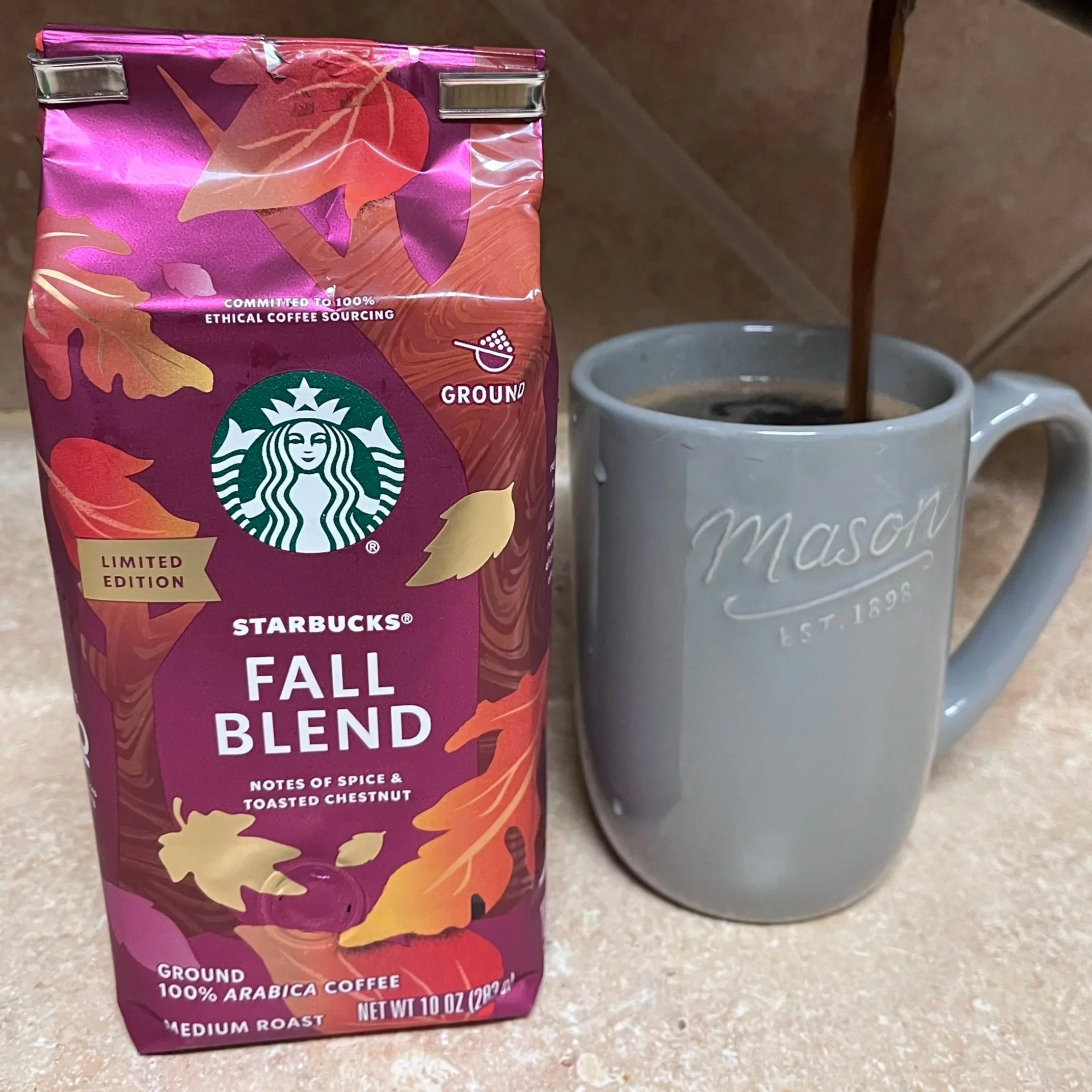 bag of coffee grounds next to coffee mug