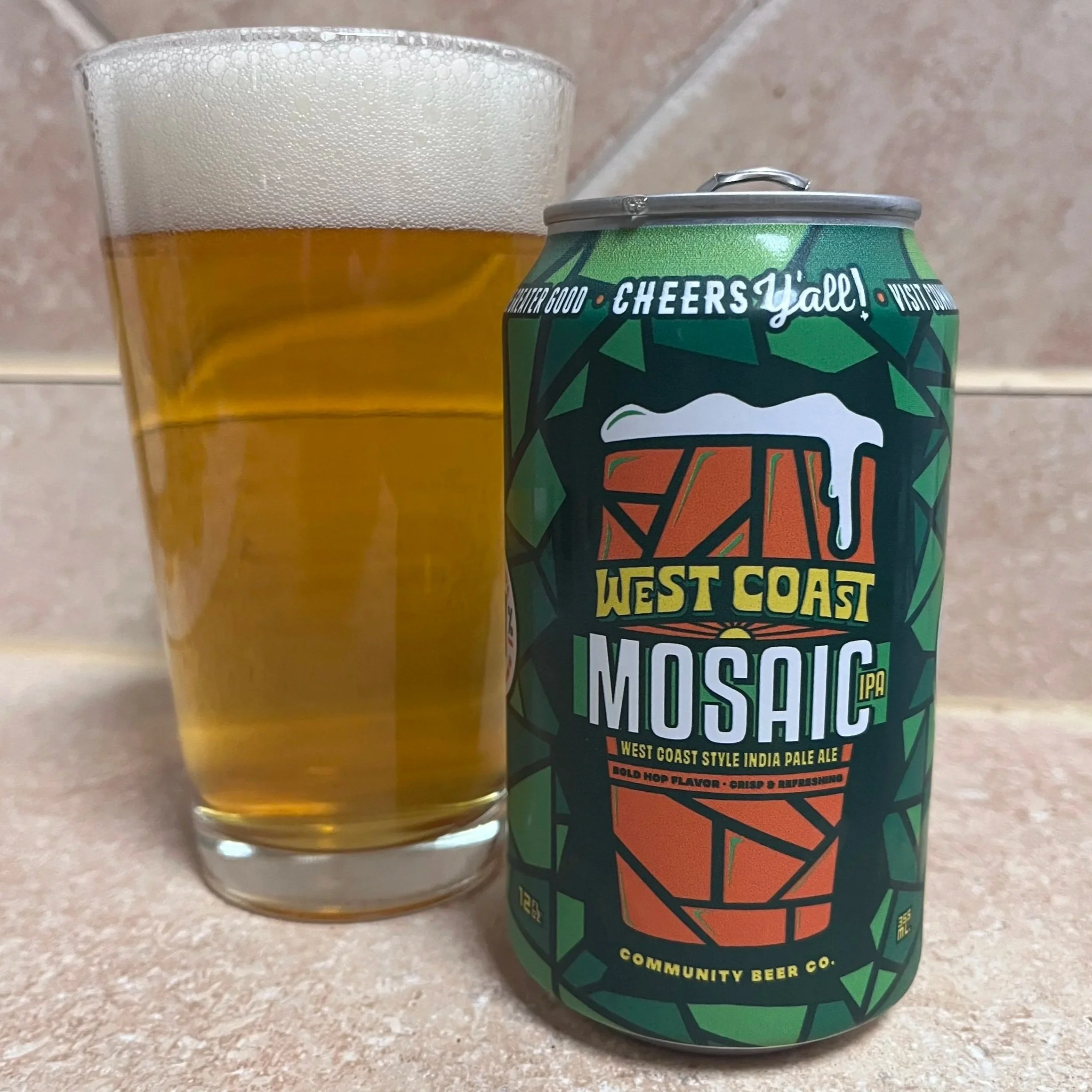 pub glass next to beer can