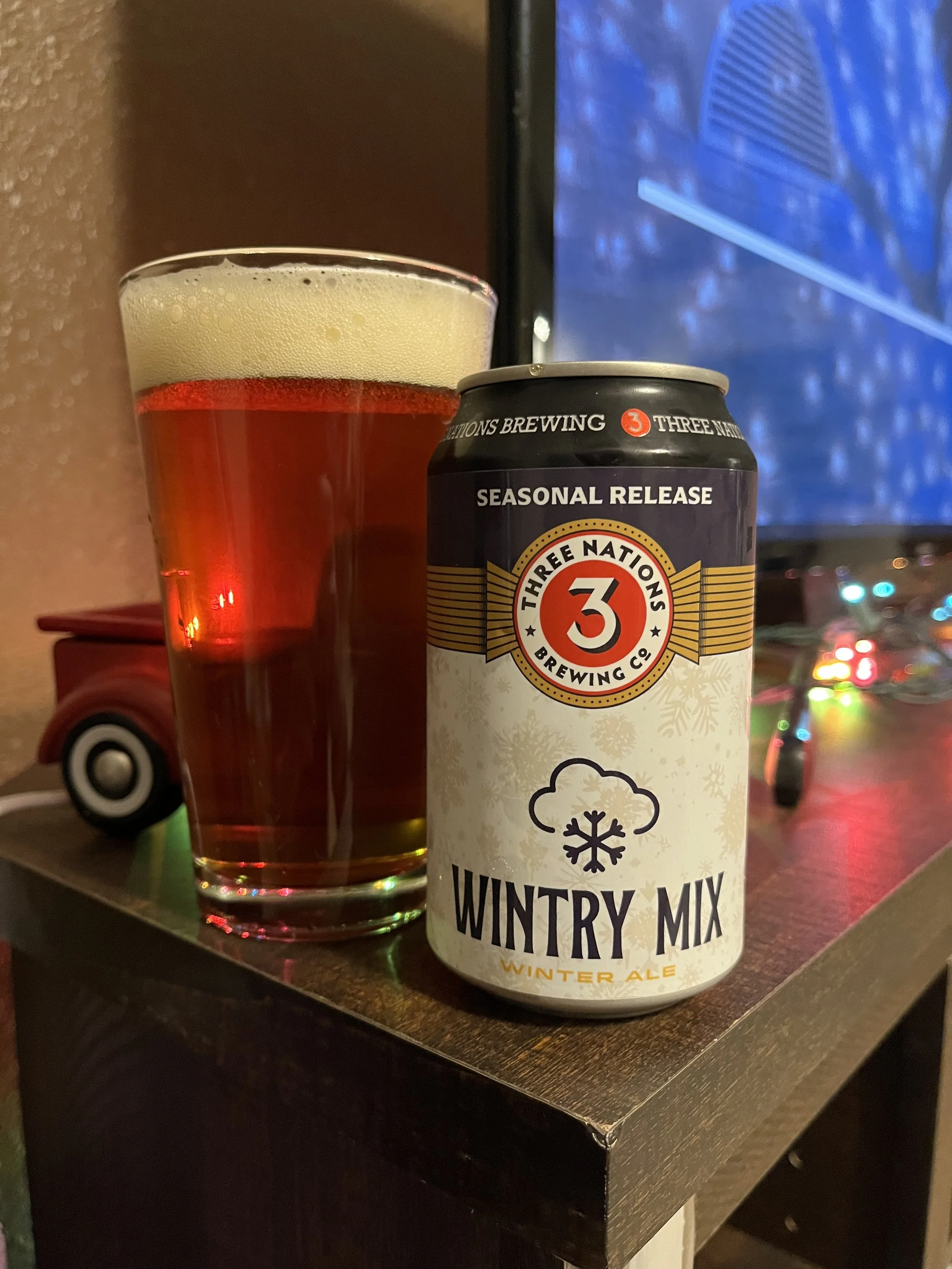 pub glass next to beer can