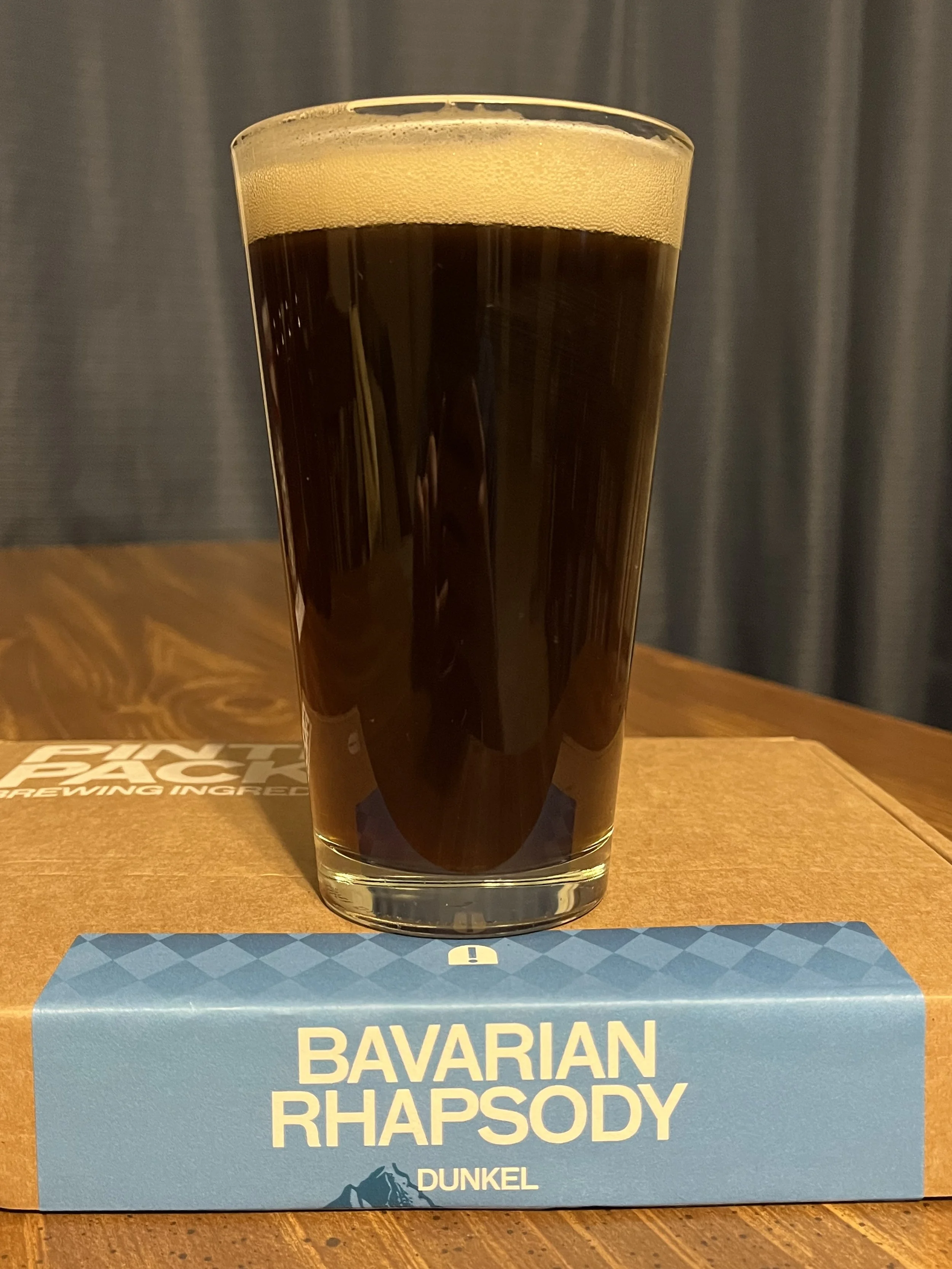 pub glass of beer on top of Pinter brewing kit box