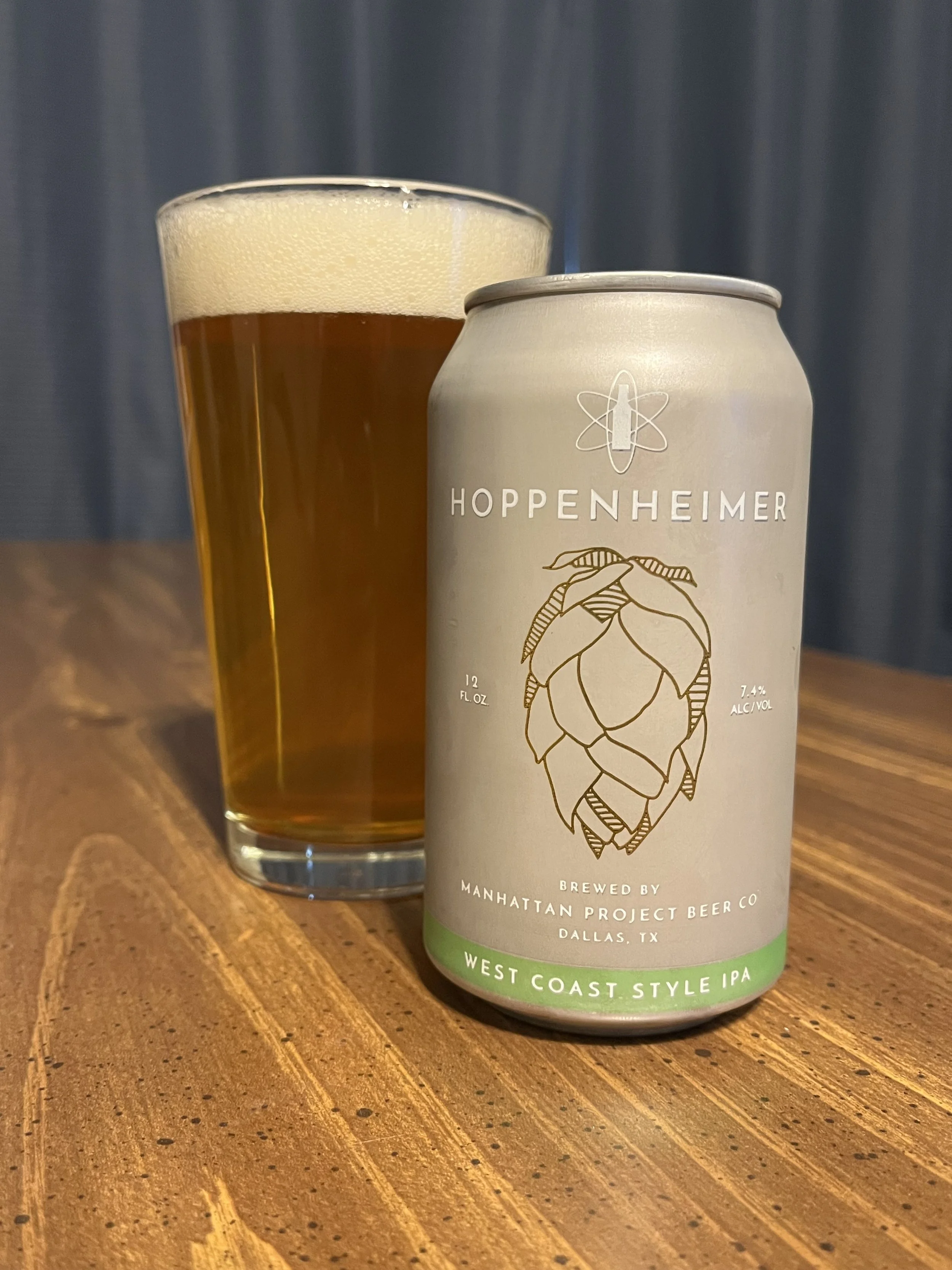 pub glass next to beer can
