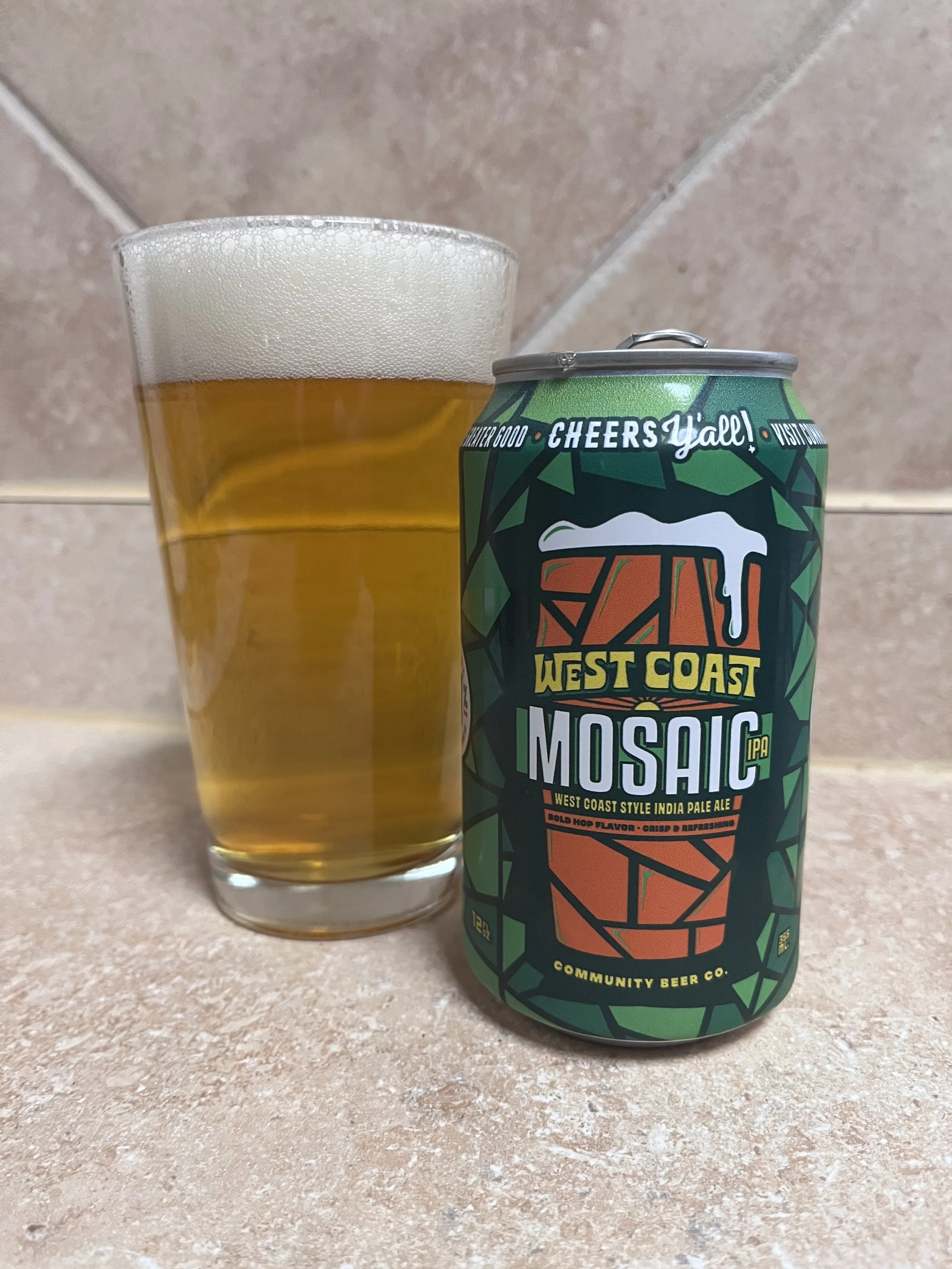 pub glass next to beer can