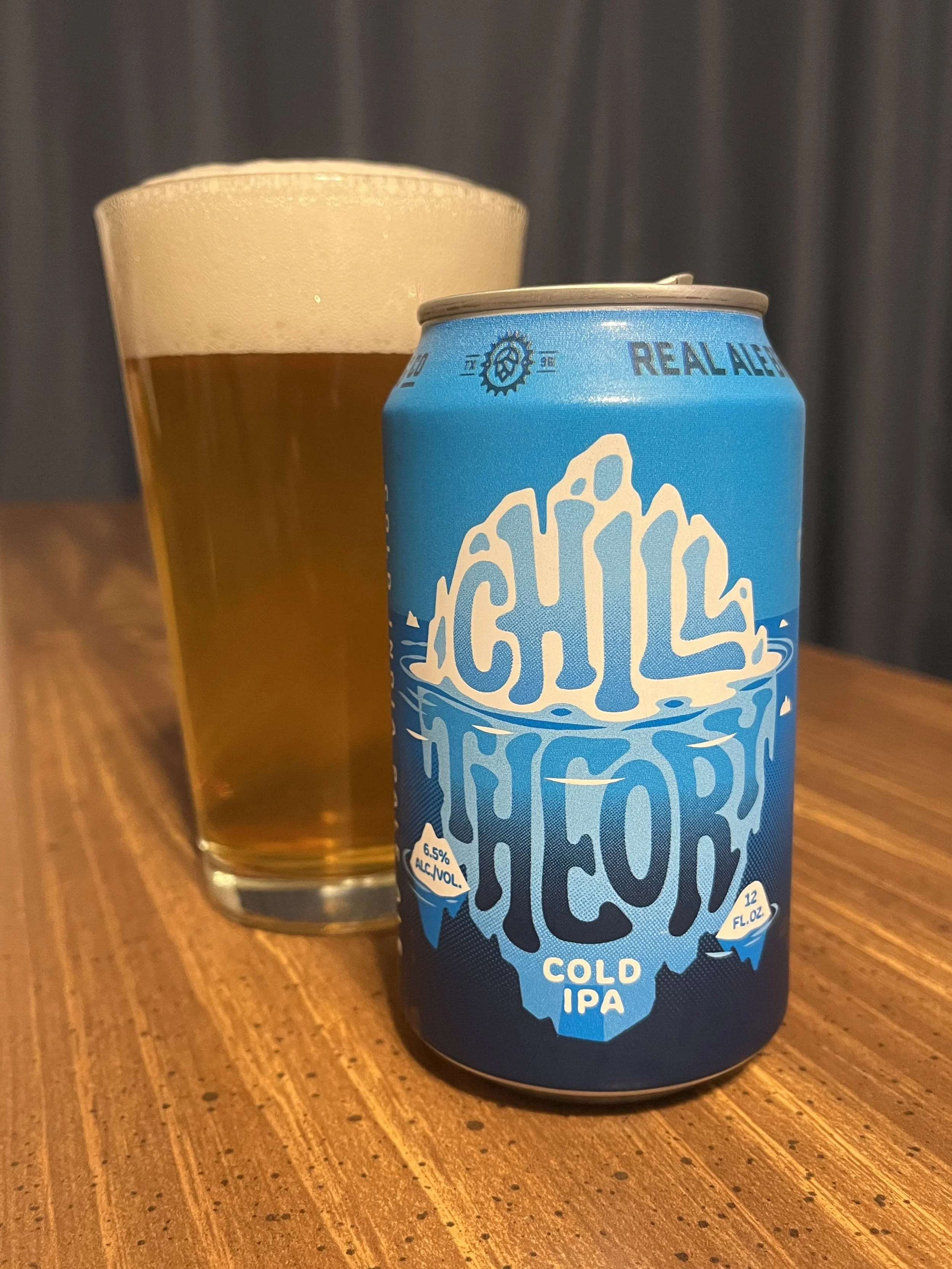 pub glass next to Real Ale beer can