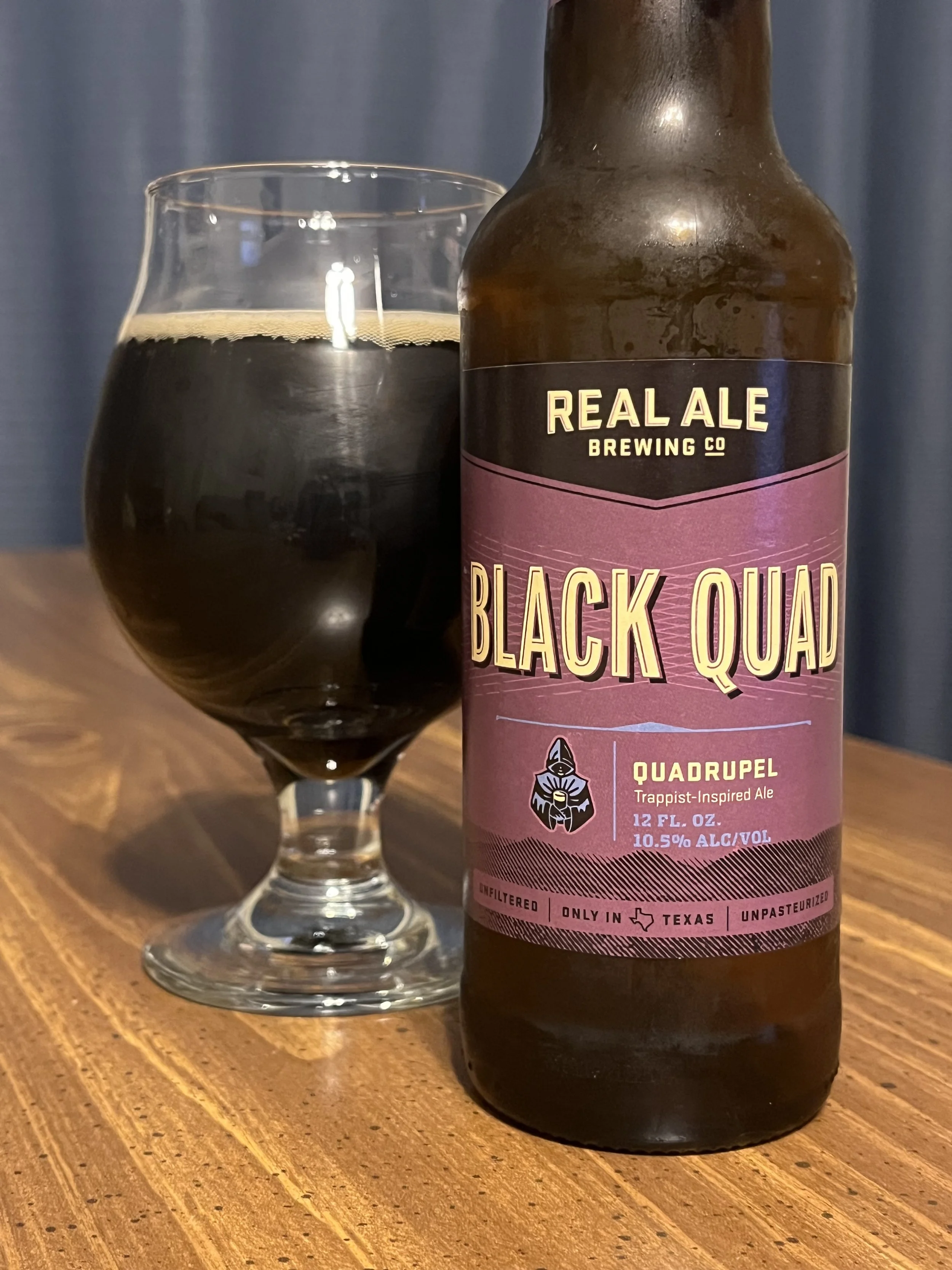tulip glass with dark "Black Quad" beer from Real Ale