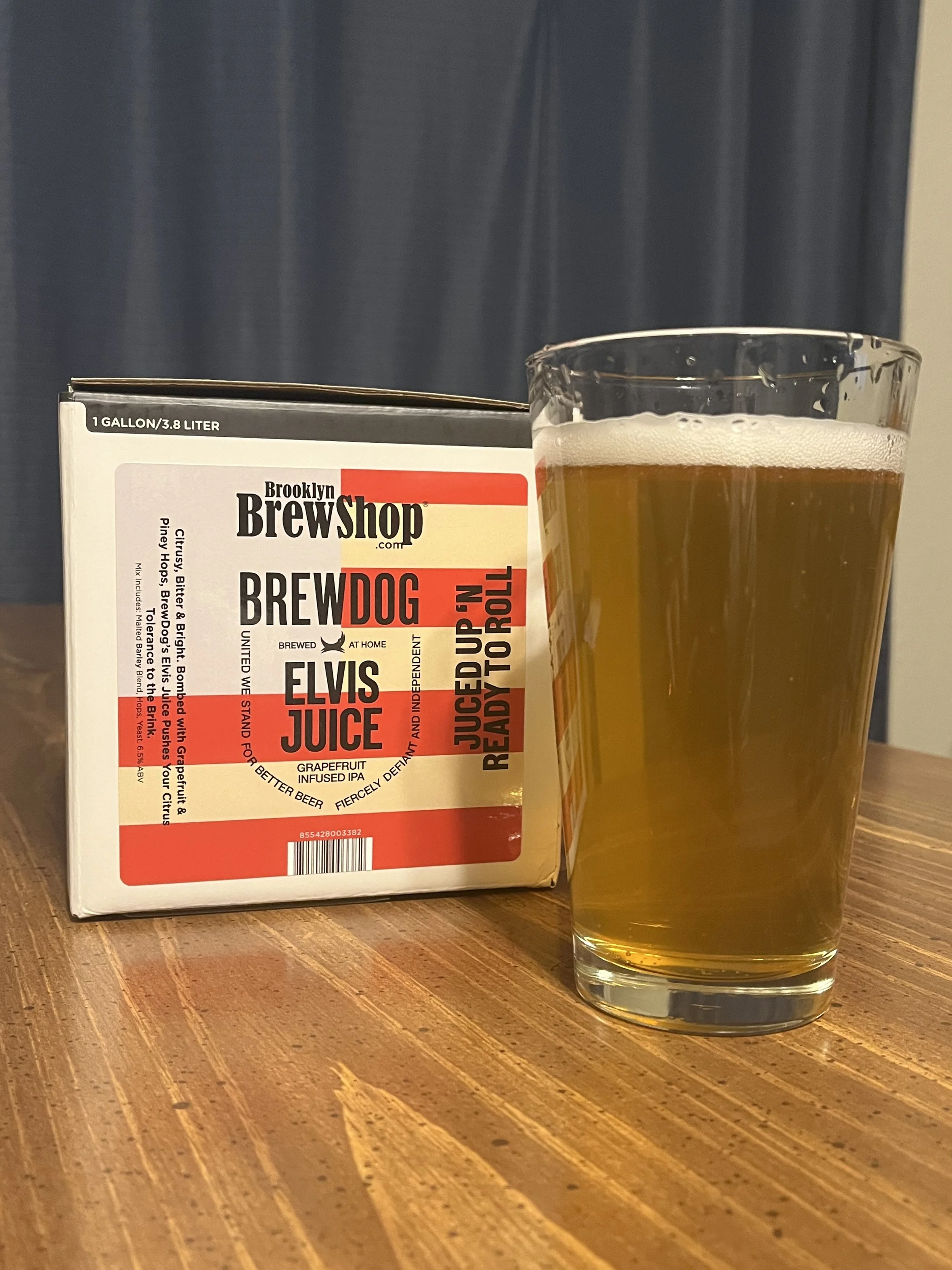brew kit box next to pub glass with homebrewed beer