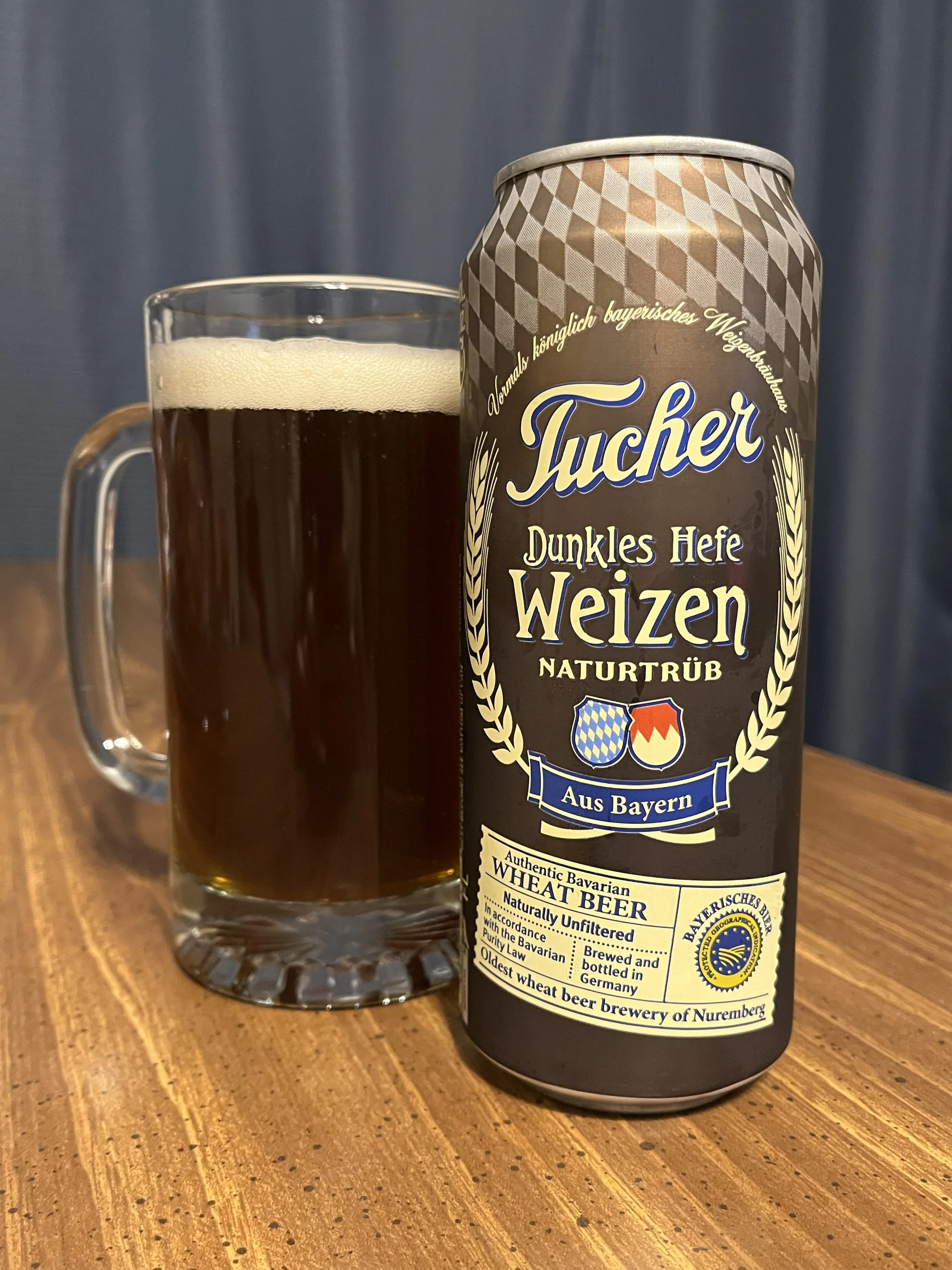 beer stein next to a beer can