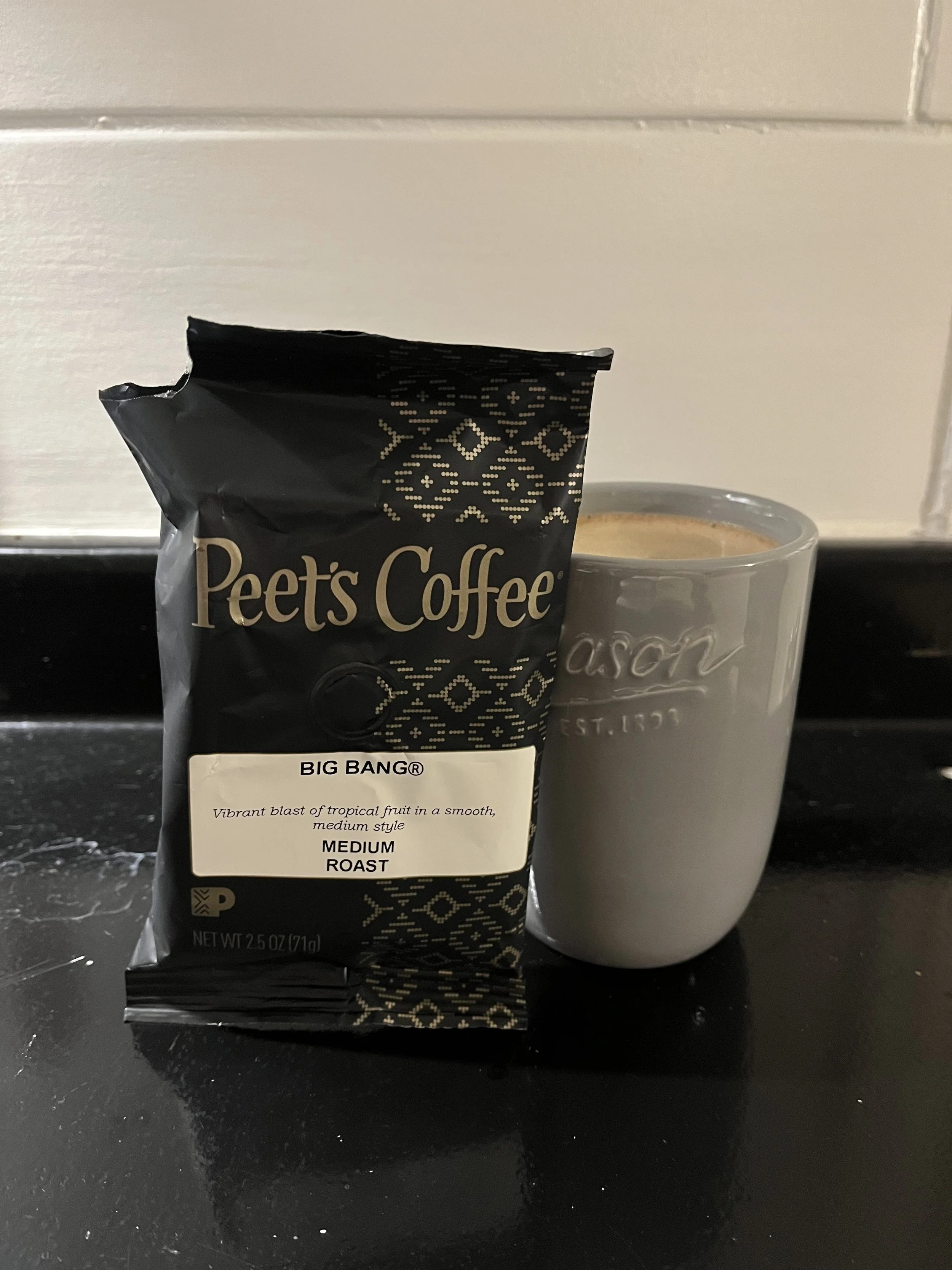 small bag of Peet's Big Bang next to a coffee mug