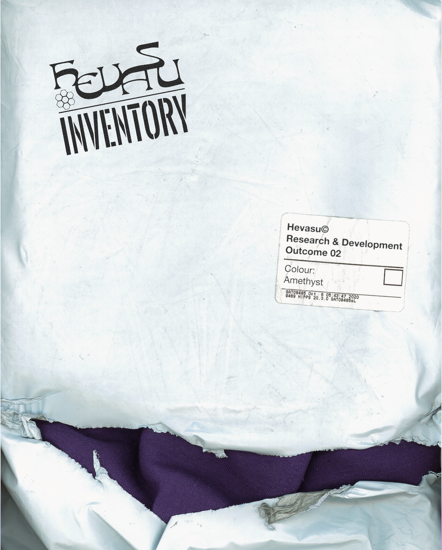 Part of a crumpled white plastic bag revealing a purple fabric with a textured surface inside.