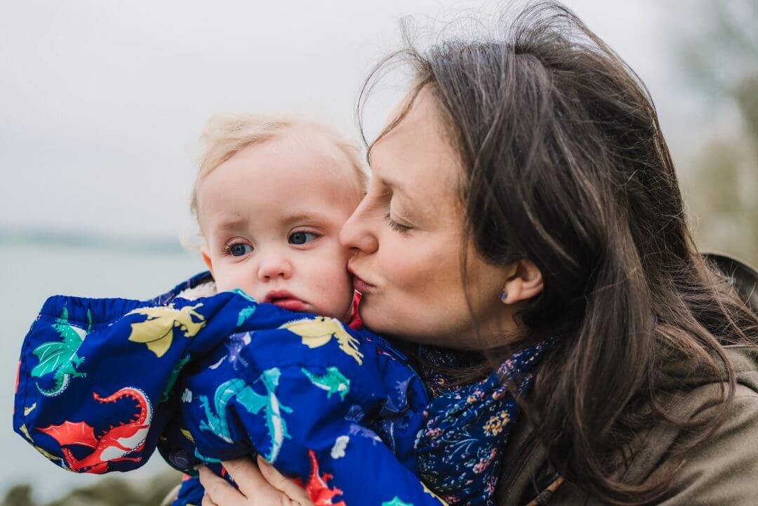 mother kissing baby son on cheek Rutland Water mothers in photos