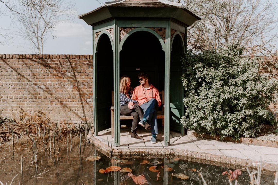 couple sitting pagoda paradise gardens, Barnsdale gardens wedding venue Rutland 