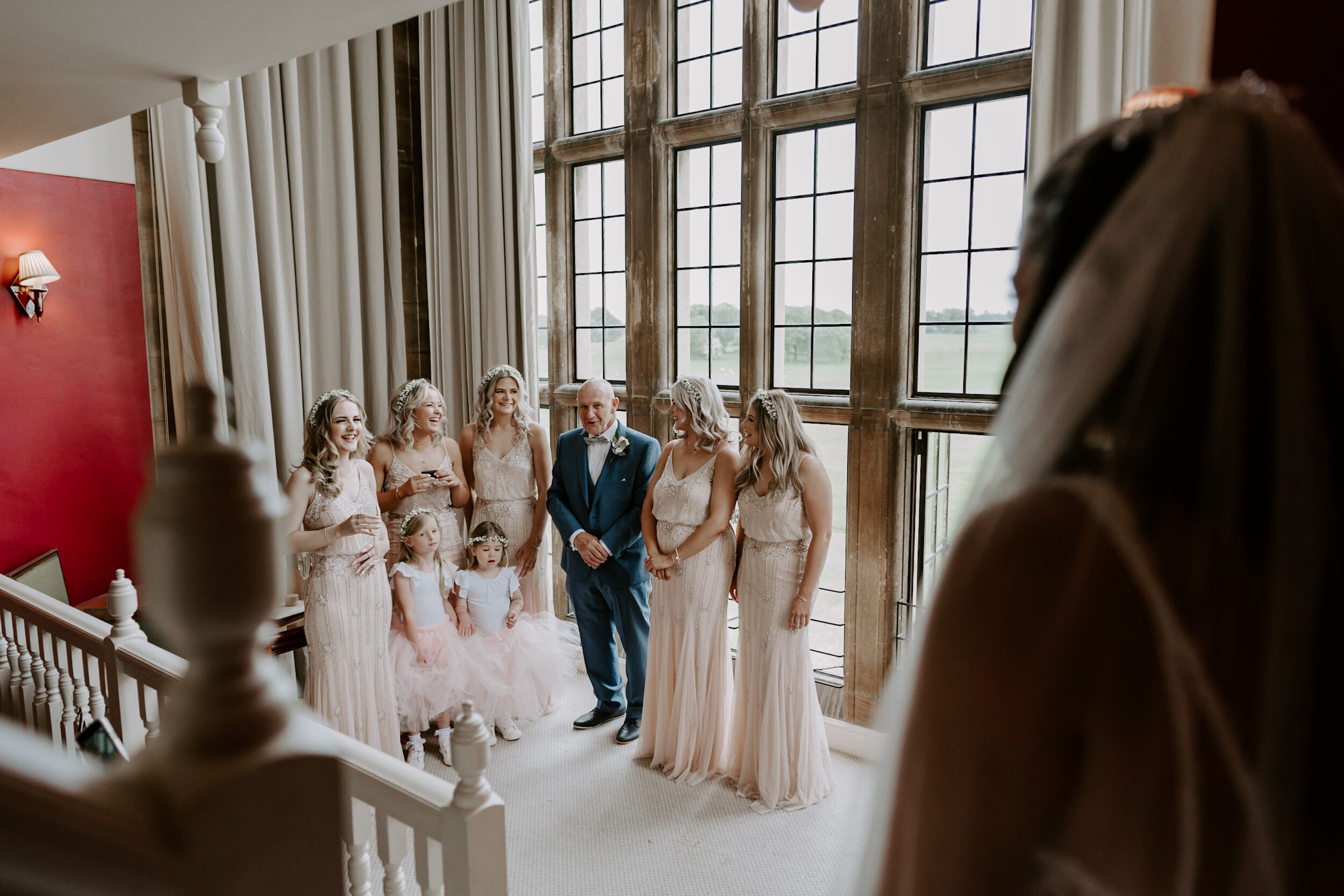 Father of the bride first look with bridesmaids Bridal suite Stapleford Park wedding