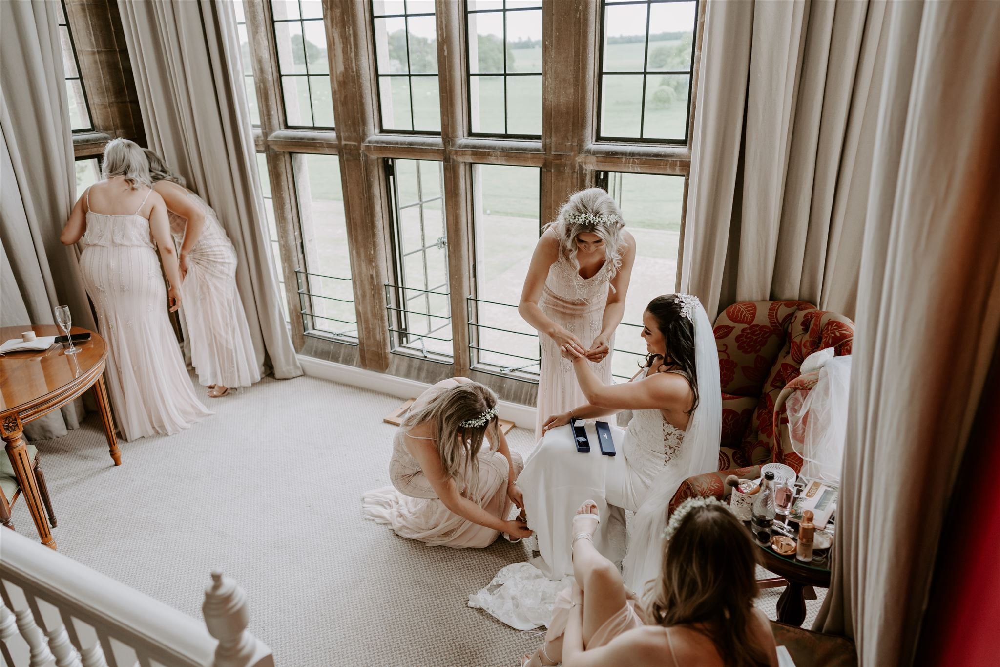 Documentary wedding photographs bridal party getting ready bridal suite Stapleford Park 