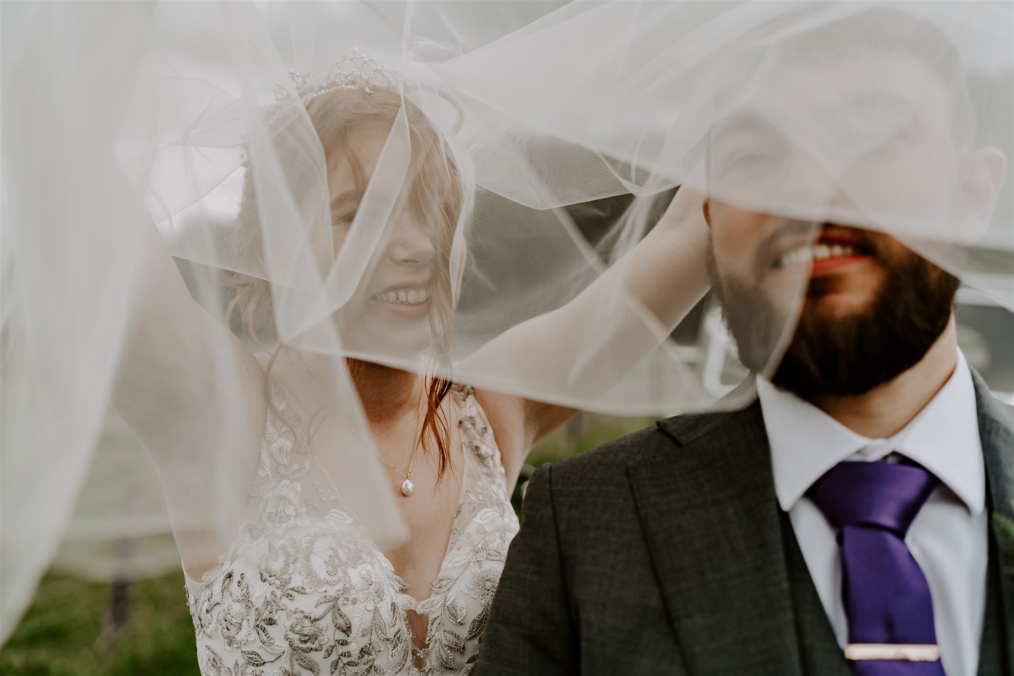 wedding veil blowing in wind over bride groom Stamford wedding photographer