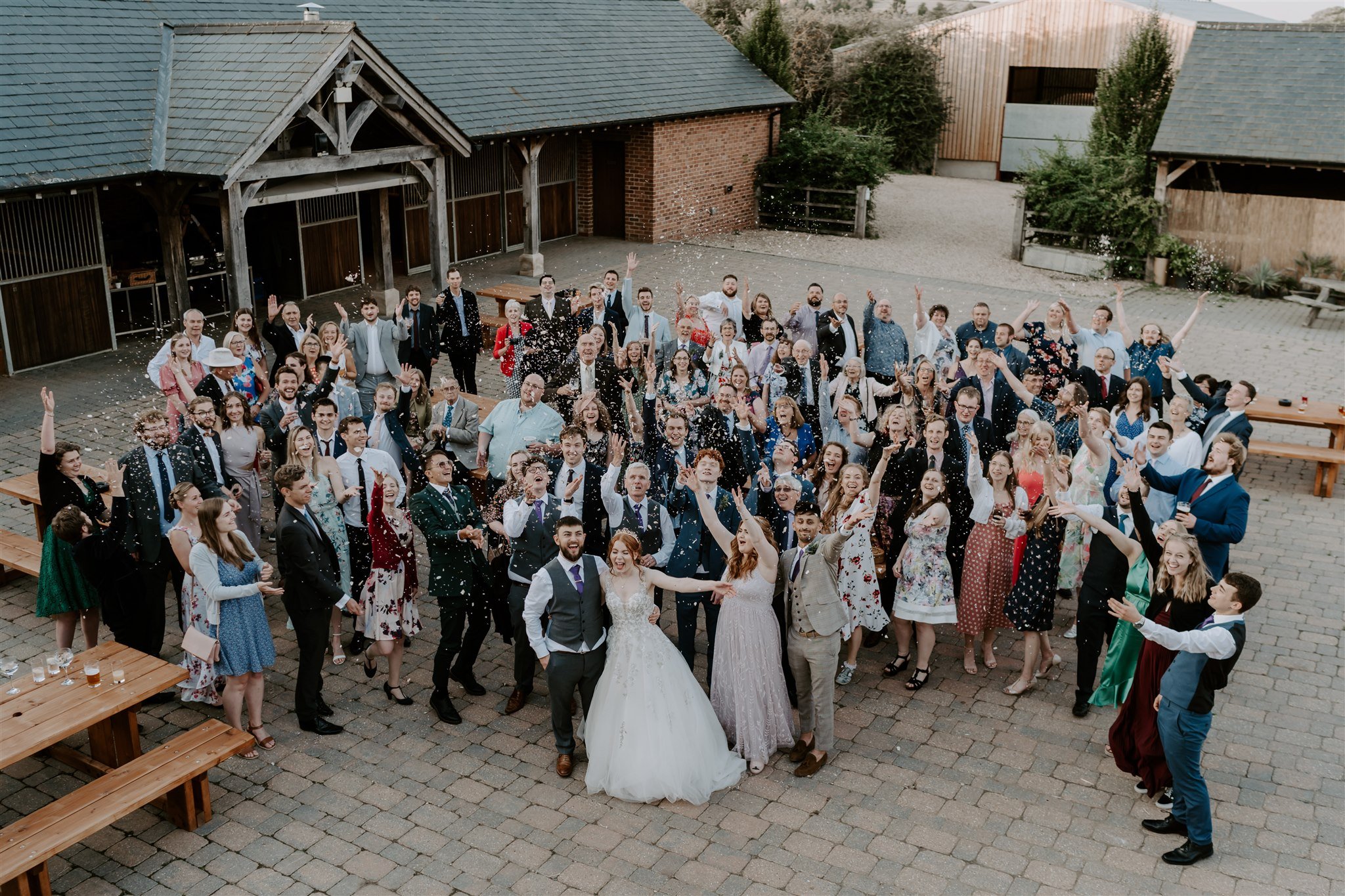 Wedding group photo with confetti Stamford wedding photographer