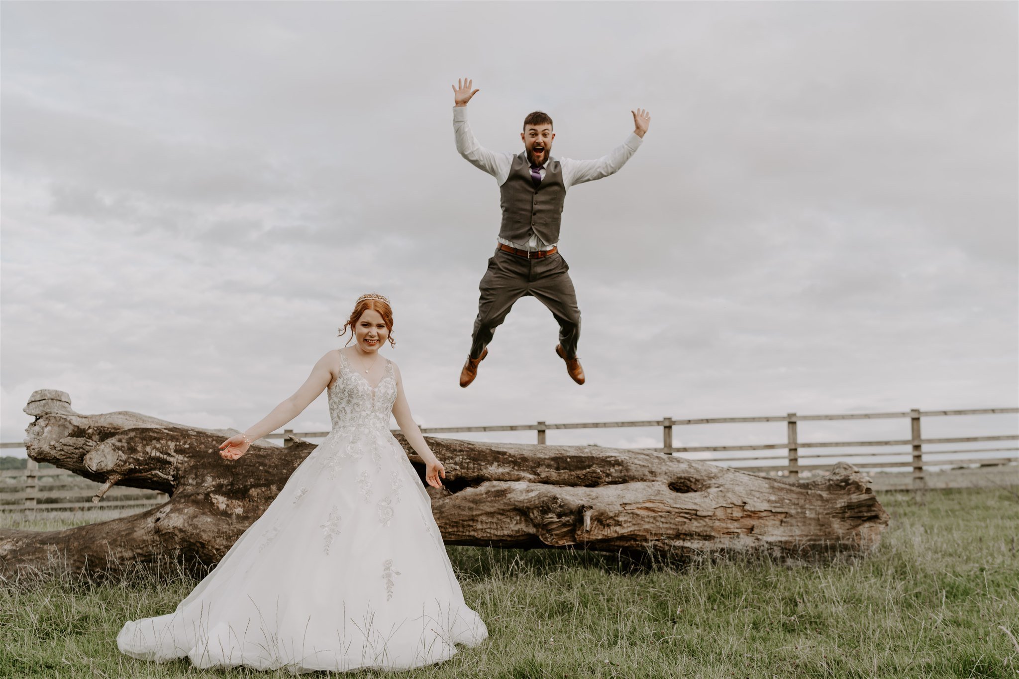 groom jumping off log fun wedding photo Stamford wedding photographer
