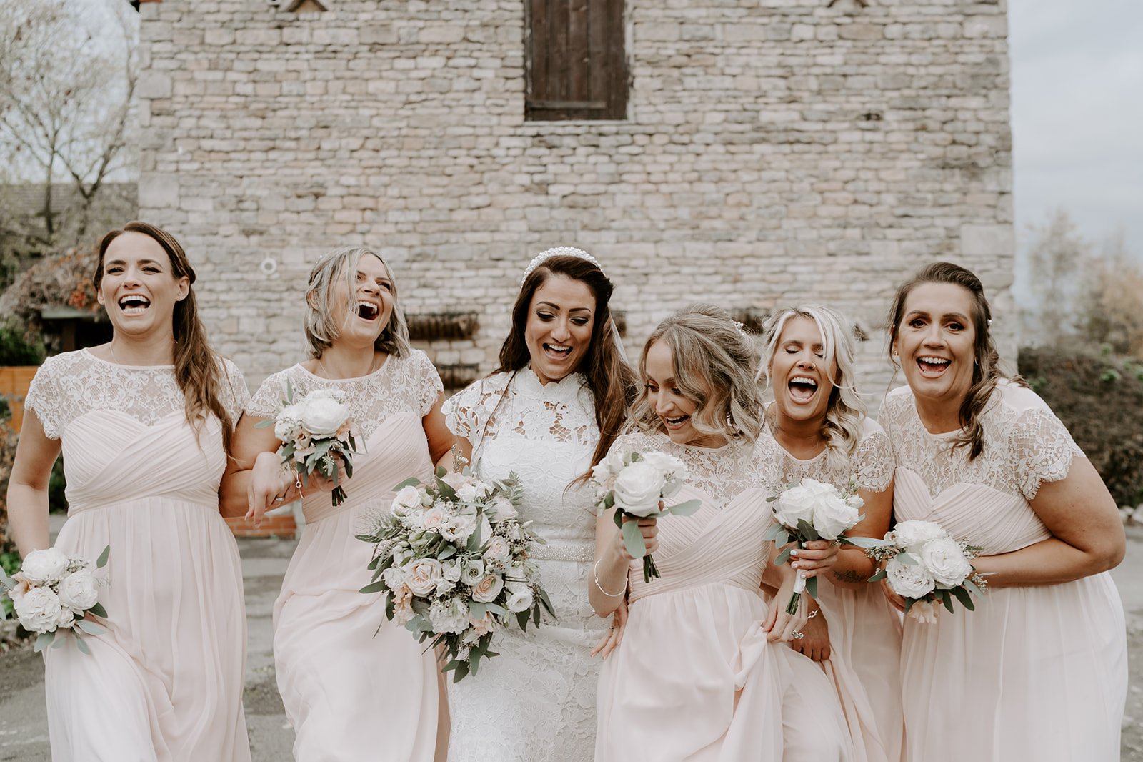 bridesmaids pink dresses laughing Barnsdale lodge hotel wedding photography