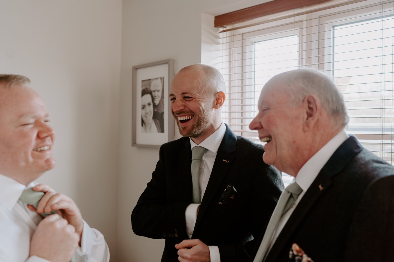 groom getting ready with groomsmen Halfmoon Farm wedding 