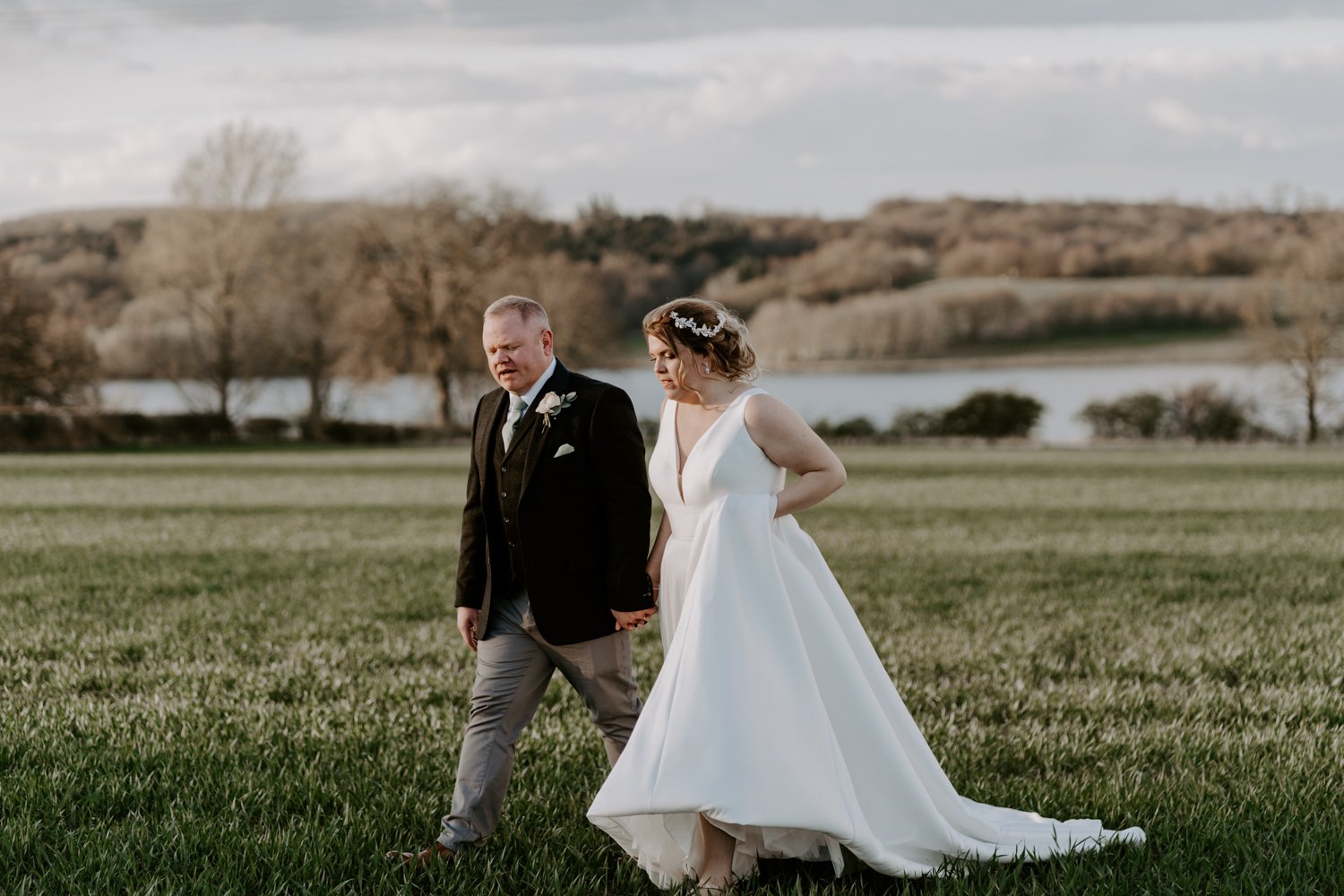 couple walking in Halfmoon farm wedding Hambleton