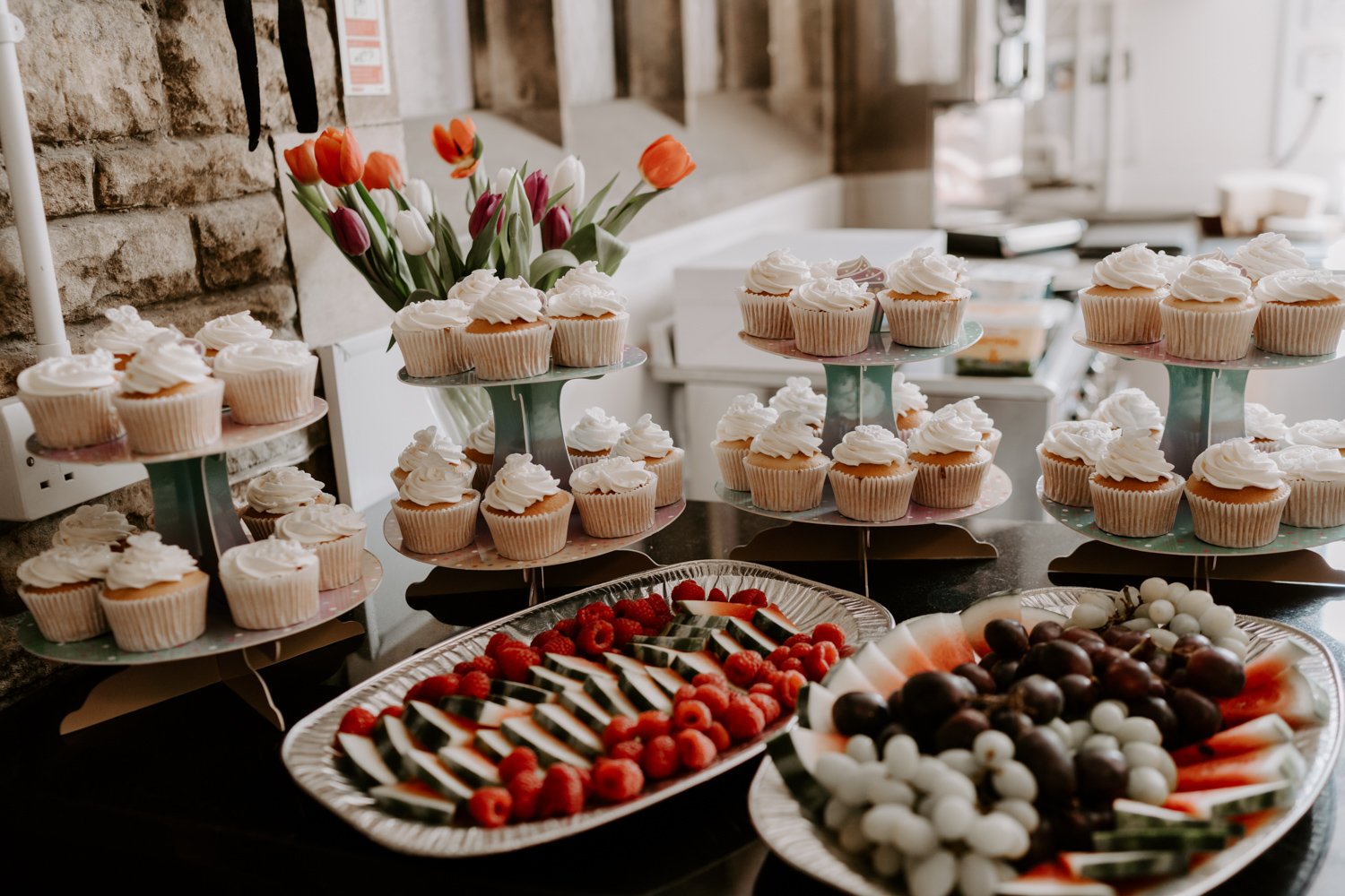 wedding buffet spread cakes fruit mardi gras village hall wedding Peterborough