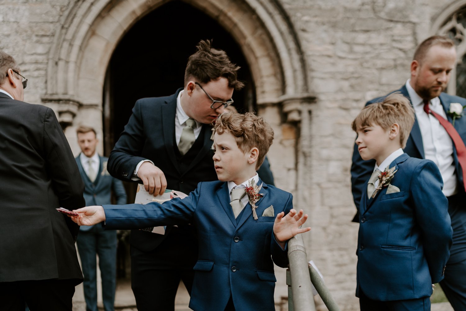 young boy handing out confetti mardi gras village hall wedding Peterborough